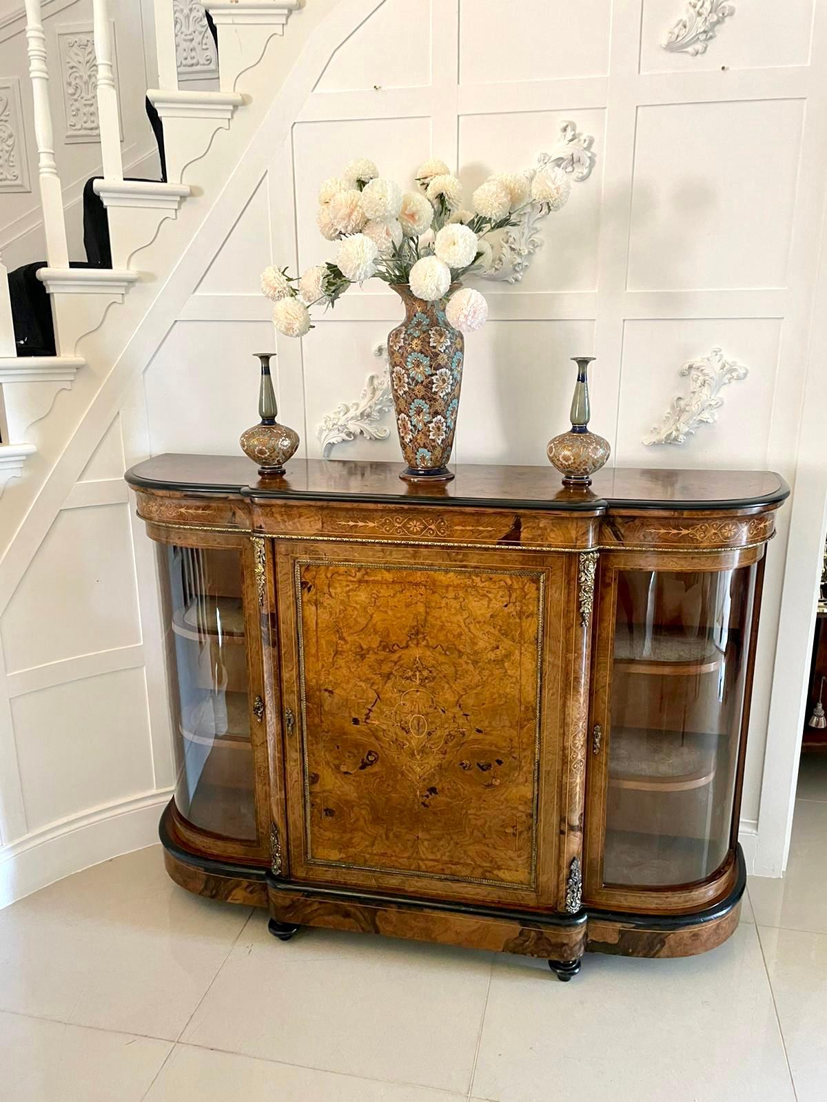 Superb quality antique Victorian burr walnut inlaid credenza having a quality burr walnut shaped top with an ebonised moulded edge above a shaped burr walnut inlaid frieze, single burr walnut inlaid door to the centre with ormolu mounts opening to