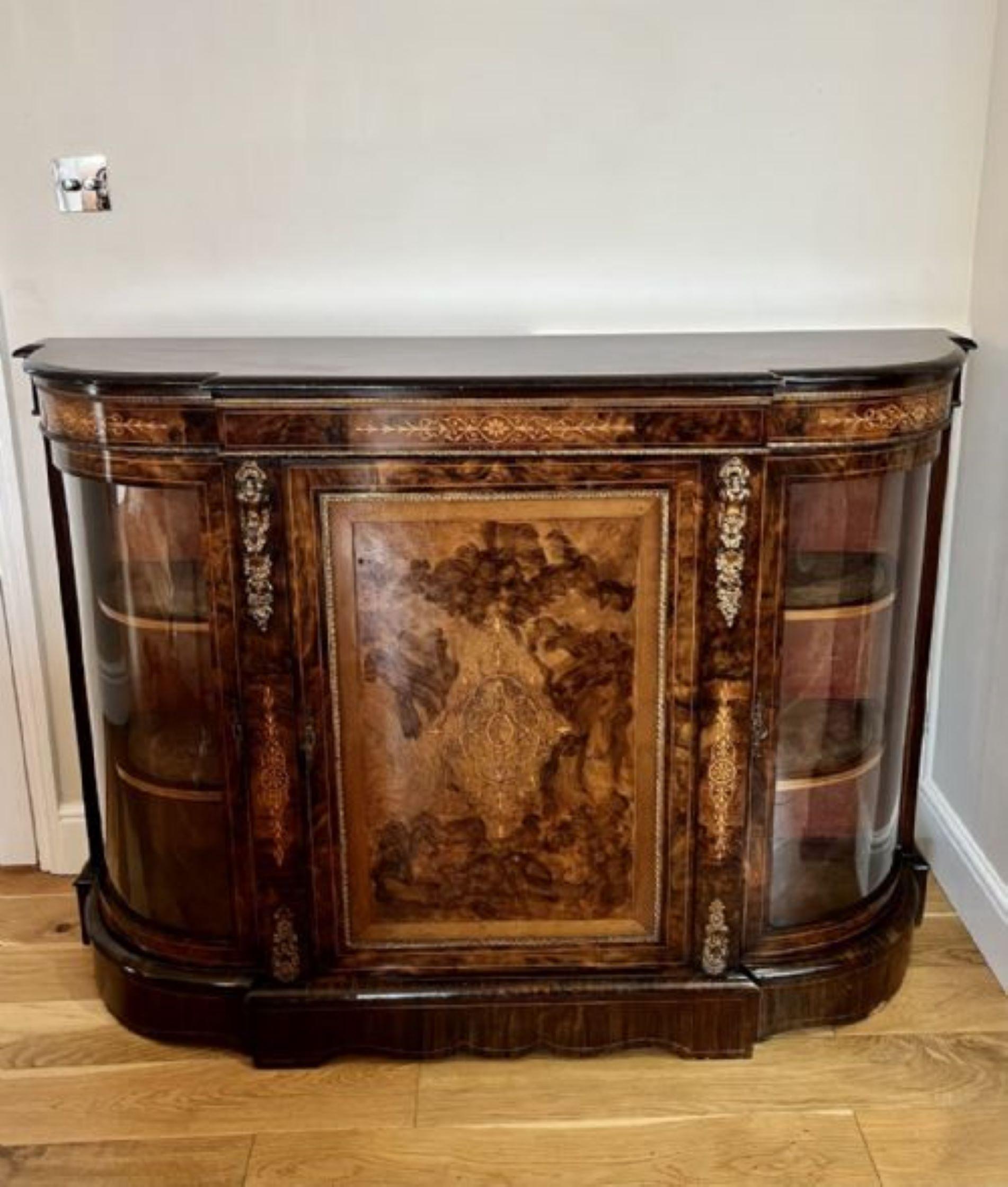 Superb quality antique Victorian burr walnut inlaid credenza having a quality burr walnut shaped top with an ebonies moulded edge above a shaped burr walnut inlaid frieze, single burr walnut inlaid door to the centre with ormolu mounts opening to