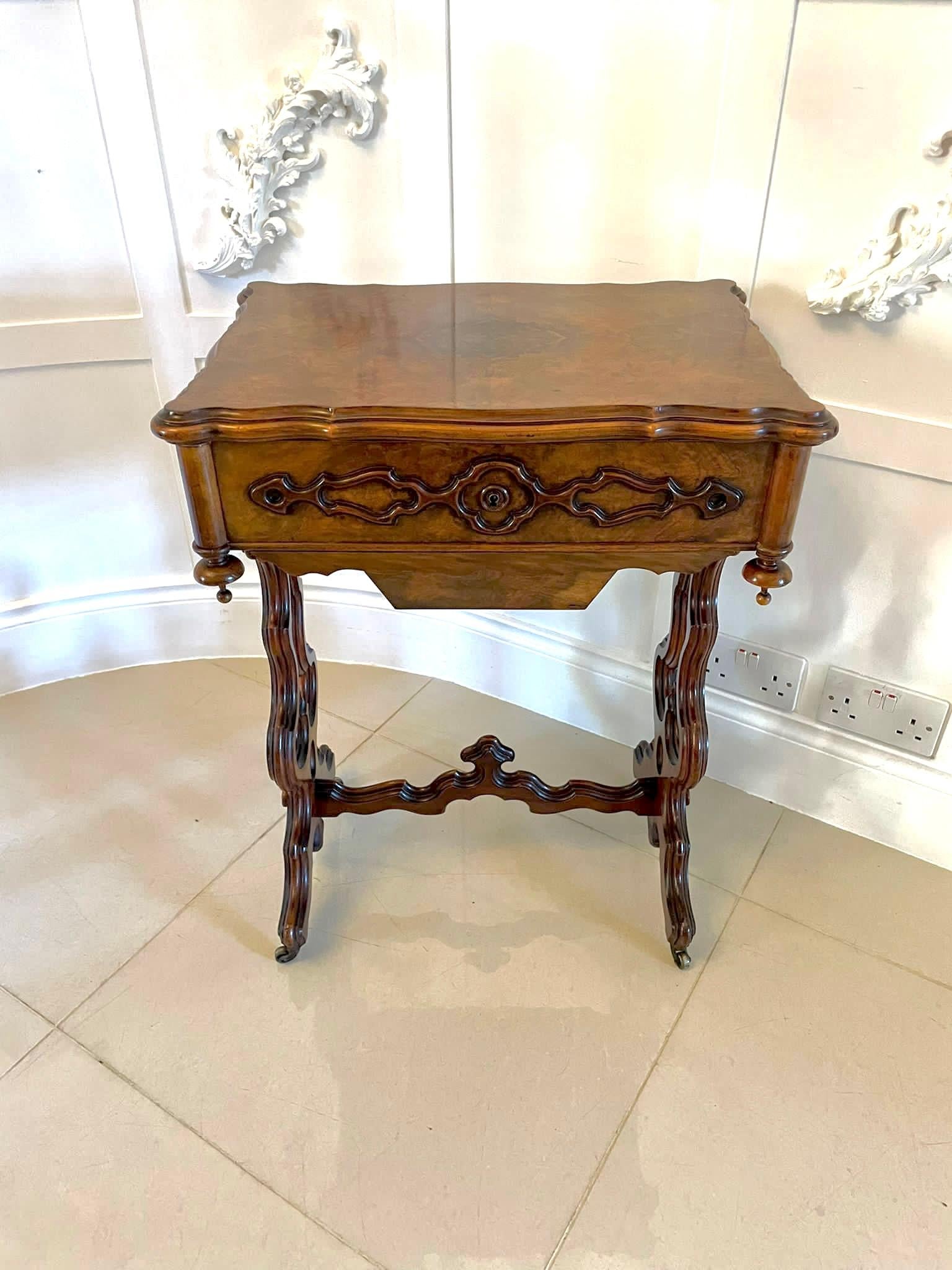 Superb quality antique Victorian burr walnut sewing table having a superb quality burr walnut shaped lift up top opening to reveal a fitted interior, a storage compartment and a fitted mirror 
Quality carved walnut sides, sliding walnut storage