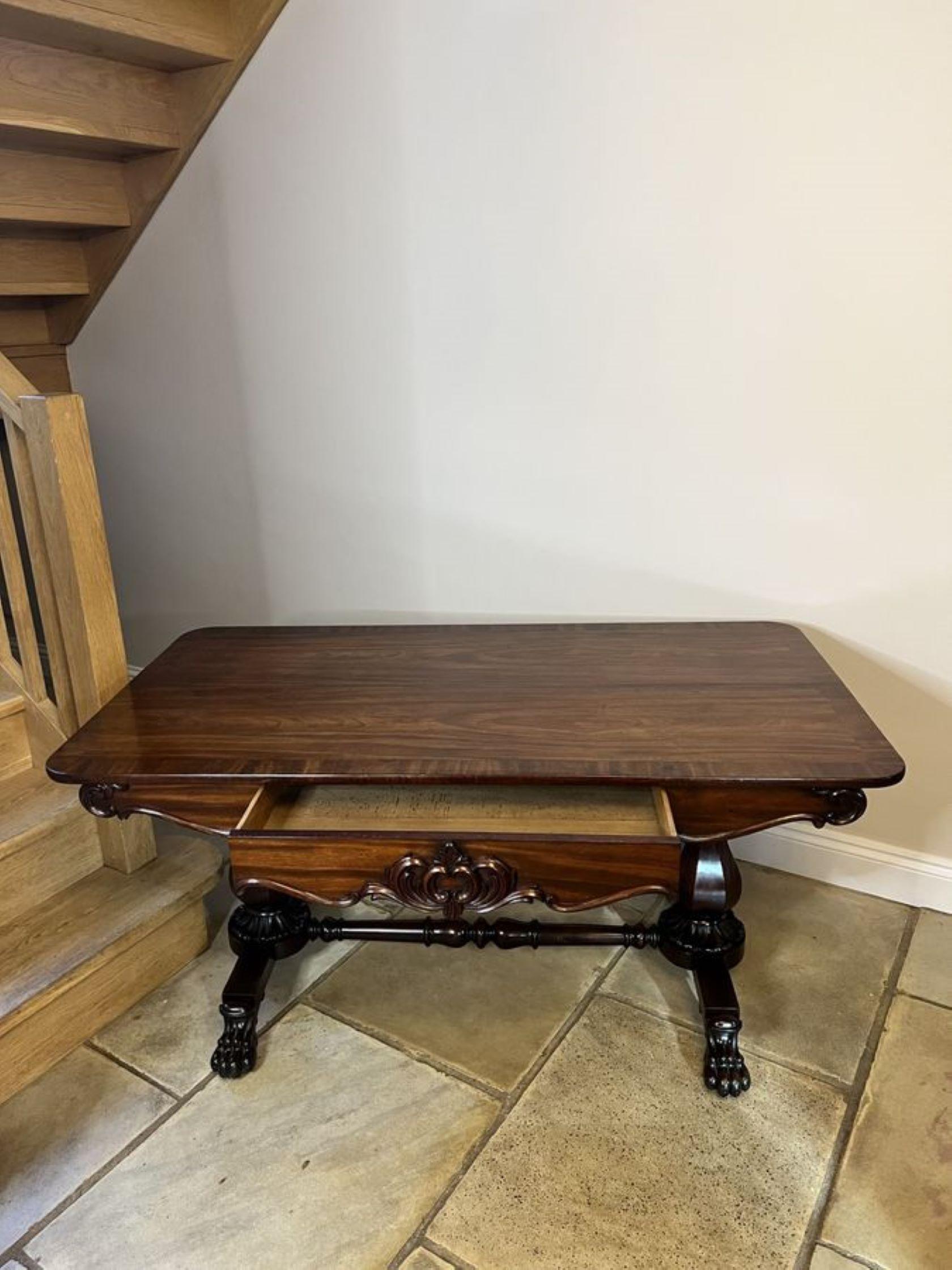 Superb quality antique William IV large freestanding library centre table having a large figured mahogany top with a crossbanded edge, carved mahogany freestanding shaped frieze, one single drawer, supported by supports with carved collars, standing