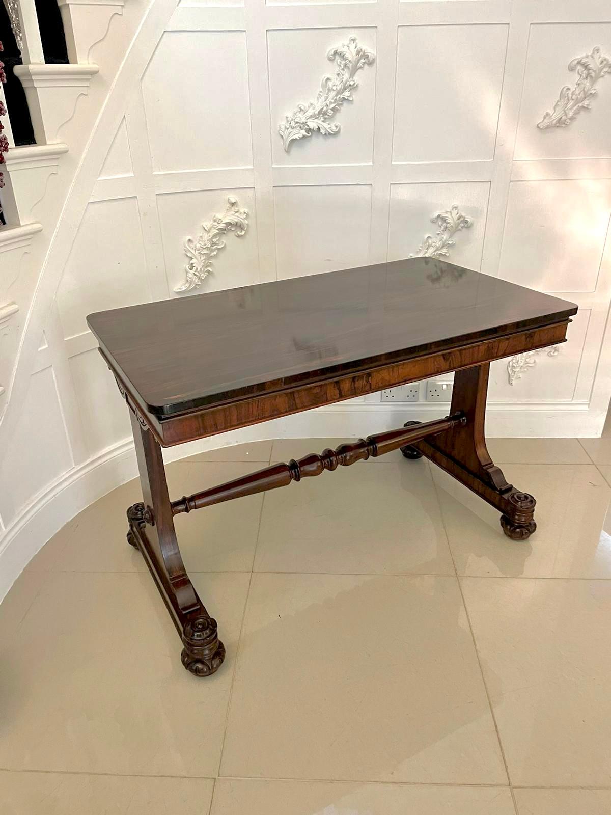 Superb quality antique William IV rosewood centre table having a superb quality rosewood top above a rosewood frieze supported by shaped carved supports standing on a platform base. It is raised by superb carved turned feet united by a turned