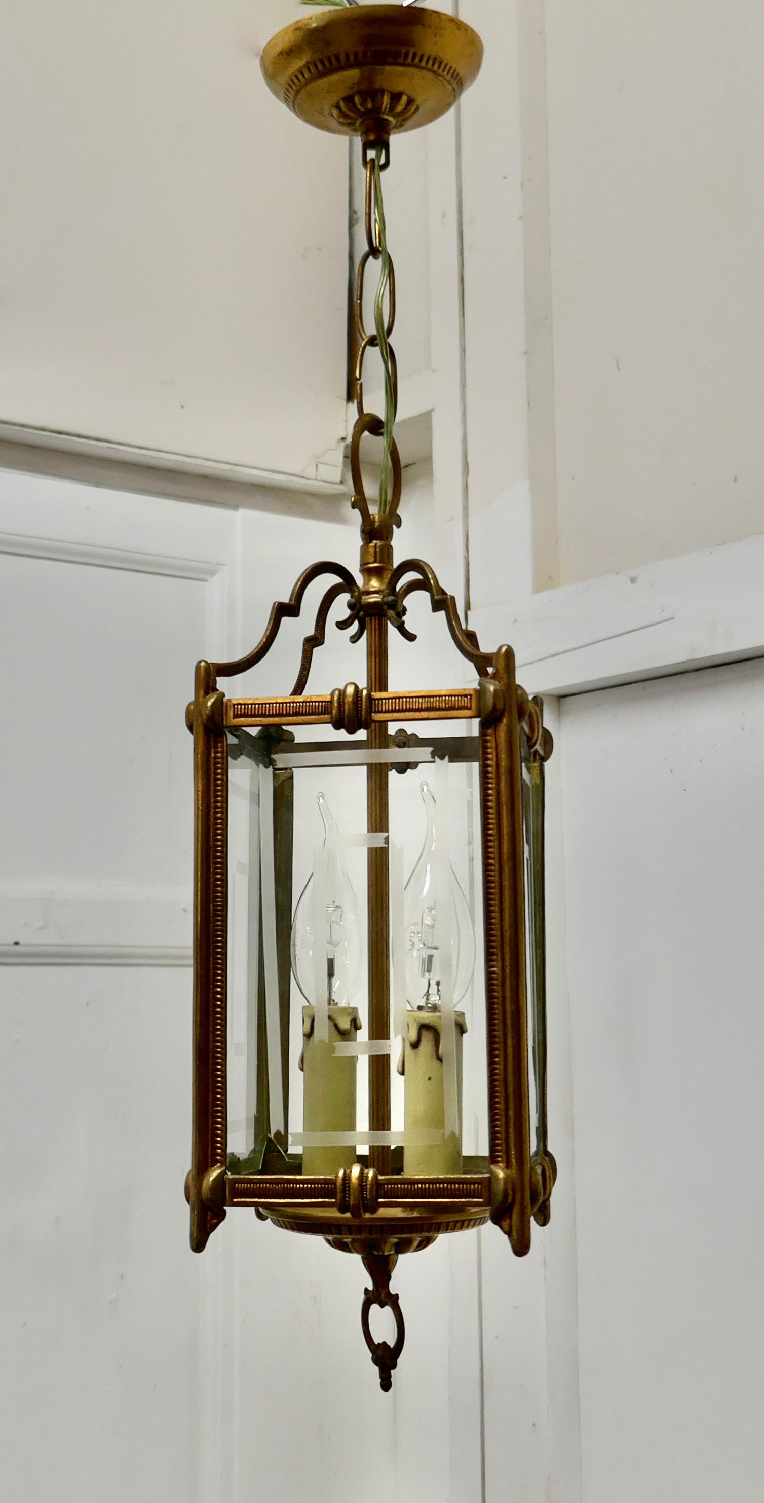 Superb quality Art Deco French brass and etched glass lantern,

This lovely light is has 4 flat etched glass panels, they are all etched with a geometric odeon type design 
The lantern has twin candle sconces and gives a sensational bright light