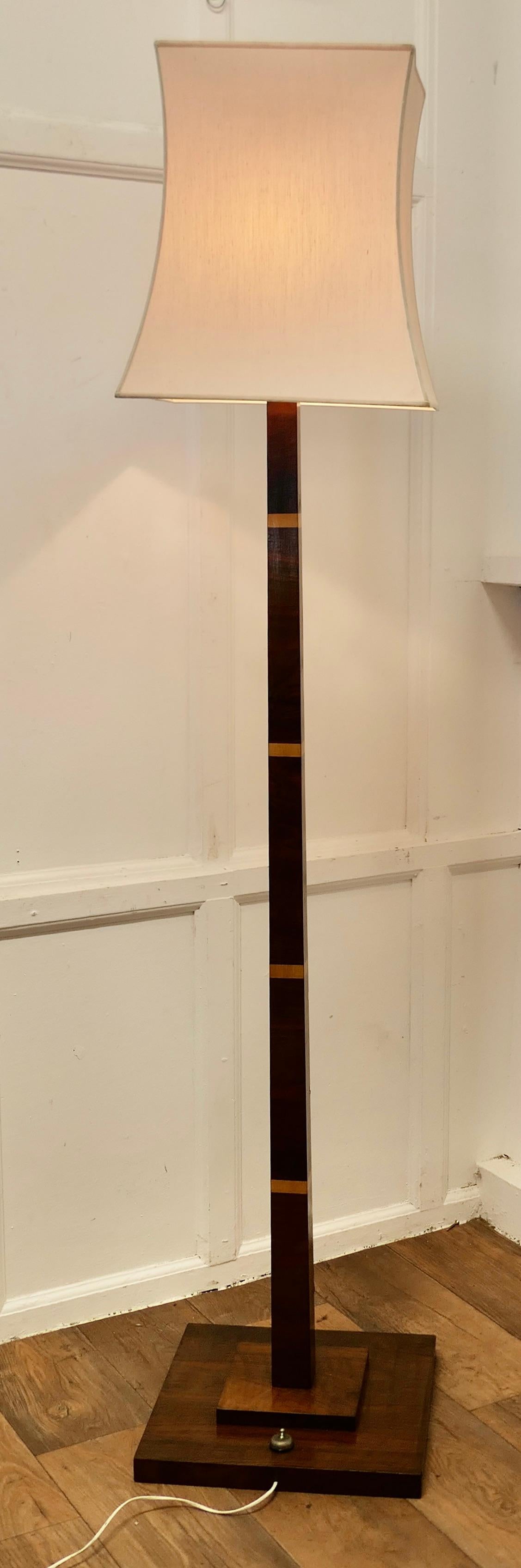 Superb Quality Art Deco Odeon Style Golden Walnut Floor Lamp 

This is a very stylish piece, the stepped walnut base supports a square shaped walnut central column with maple banding
The lamp is in good condition, working and is shown with a