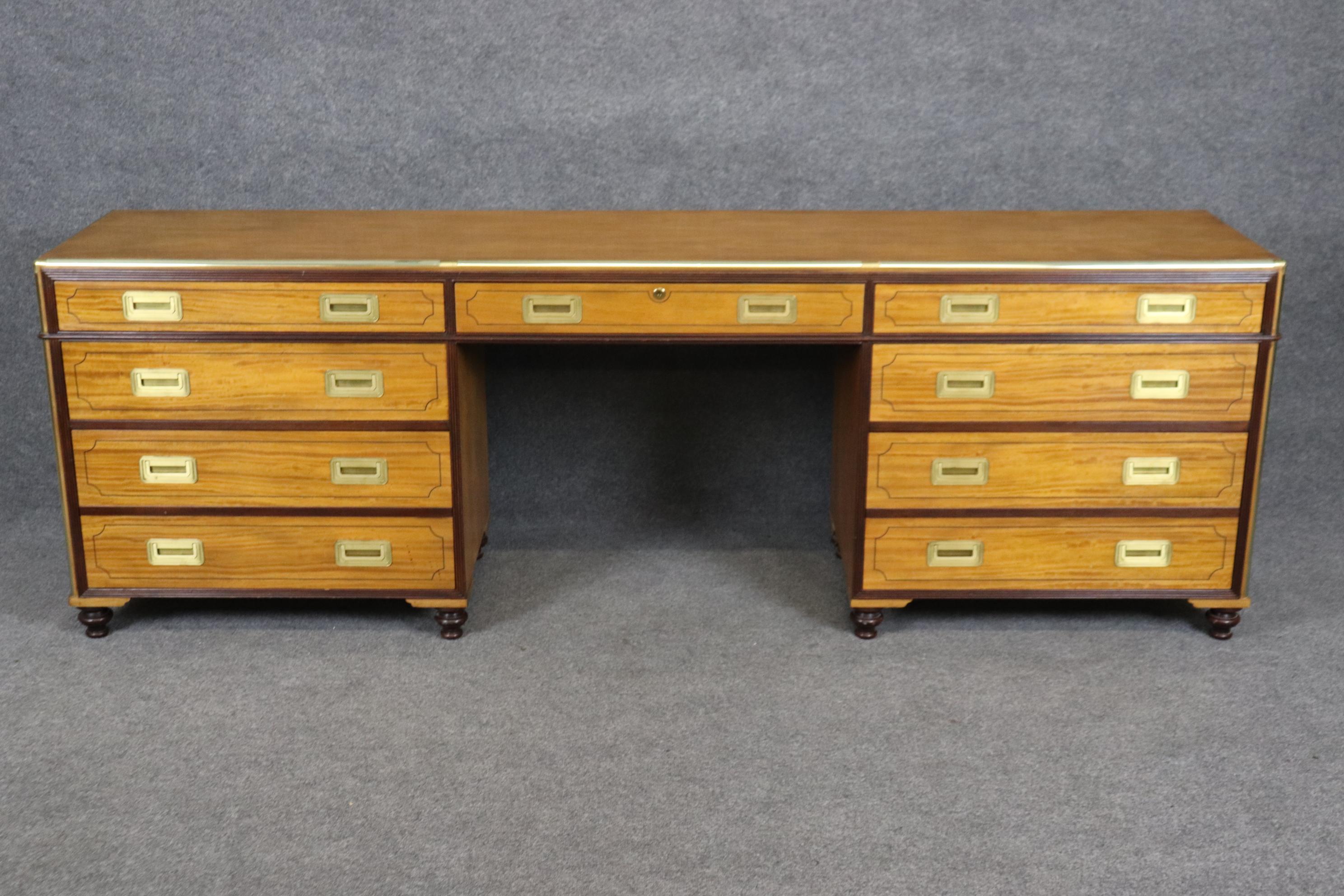 This is a Very shallow depth credenza or writing desk made of mahogany and satinwood. The piece is very wide and very shallow and is in good condition with a great looking handsome and Asian inspired design. Measures 90 inches long x 30.25 tall x