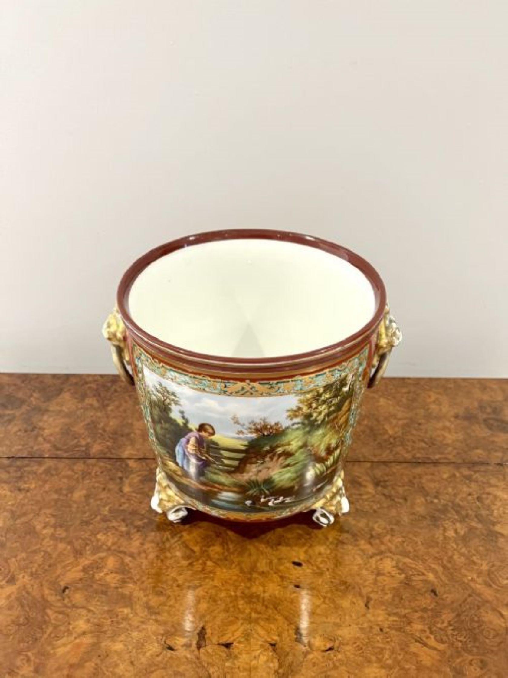 Superb quality French antique Victorian hand painted porcelain jardiniere having a superb quality French antique Victorian hand painted porcelain jardiniere to the front a landscape portrait of a river, a young lady, ducks, trees and a gate in