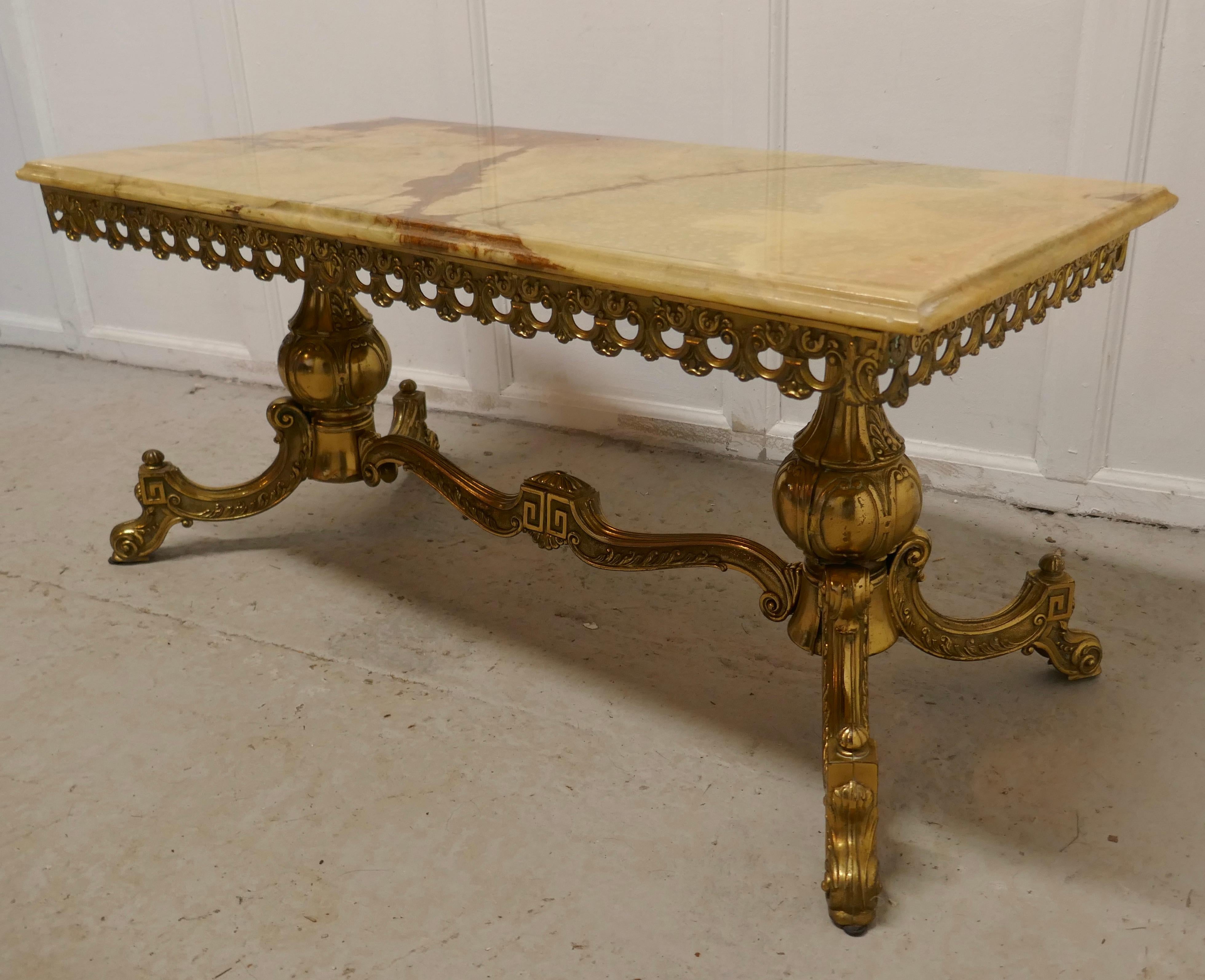 Superb Quality French brass and marble coffee table

This is a very attractive piece the legs are in the Empire style with intricate chased decoration and a waved stretcher

The top has moulded edge and is made in beautifully figured “Jasper