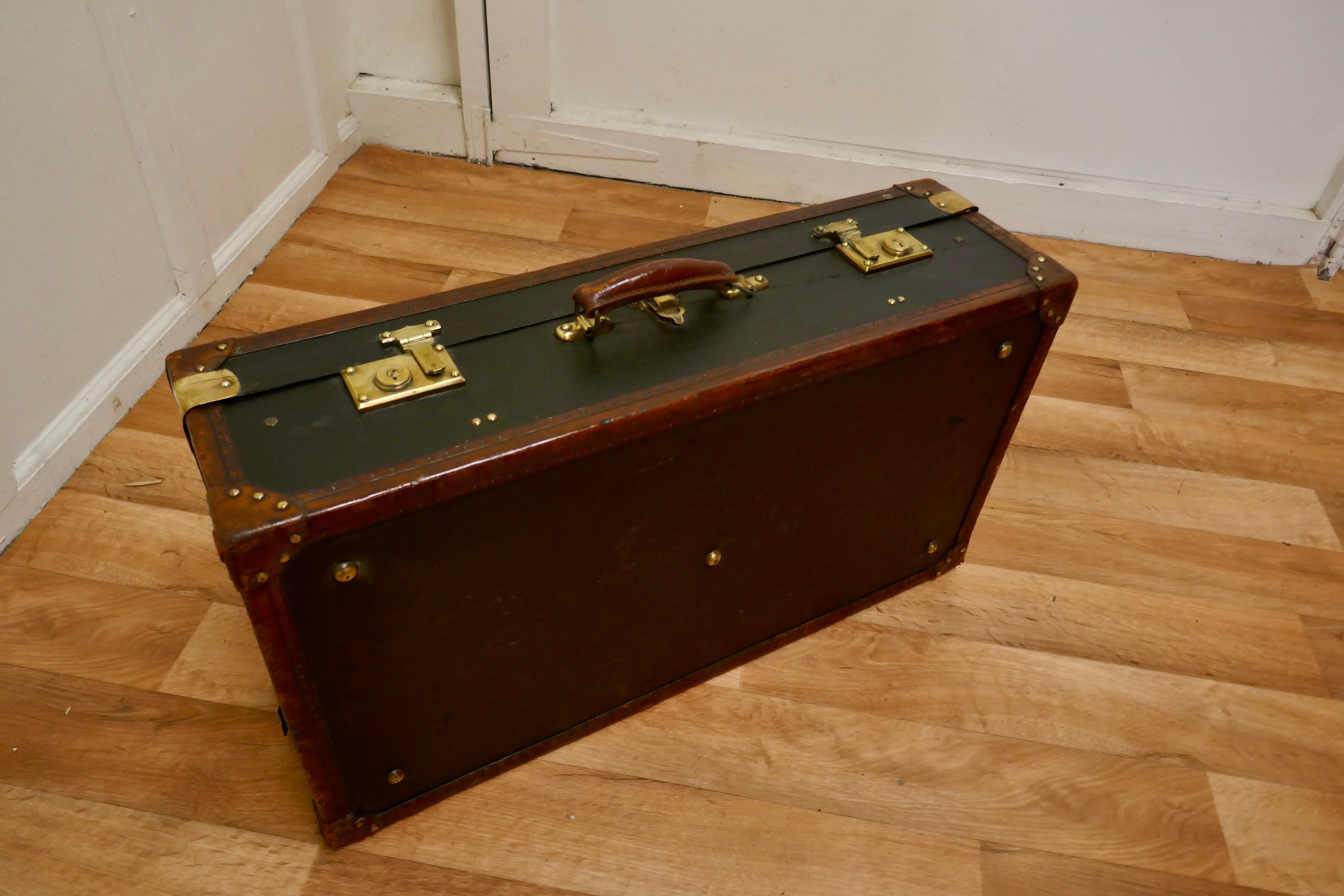 Superb quality French canvas and leather suit case.


This is a very fine quality piece it is in good condition with no tears or major blemishes, it is in black canvas with leather bandings and brass fittings
The locks are in brass and all work