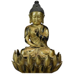 Antique Superb Quality Gilt Bronze Tibetan Buddha Seated Within a Lotus Flower Base