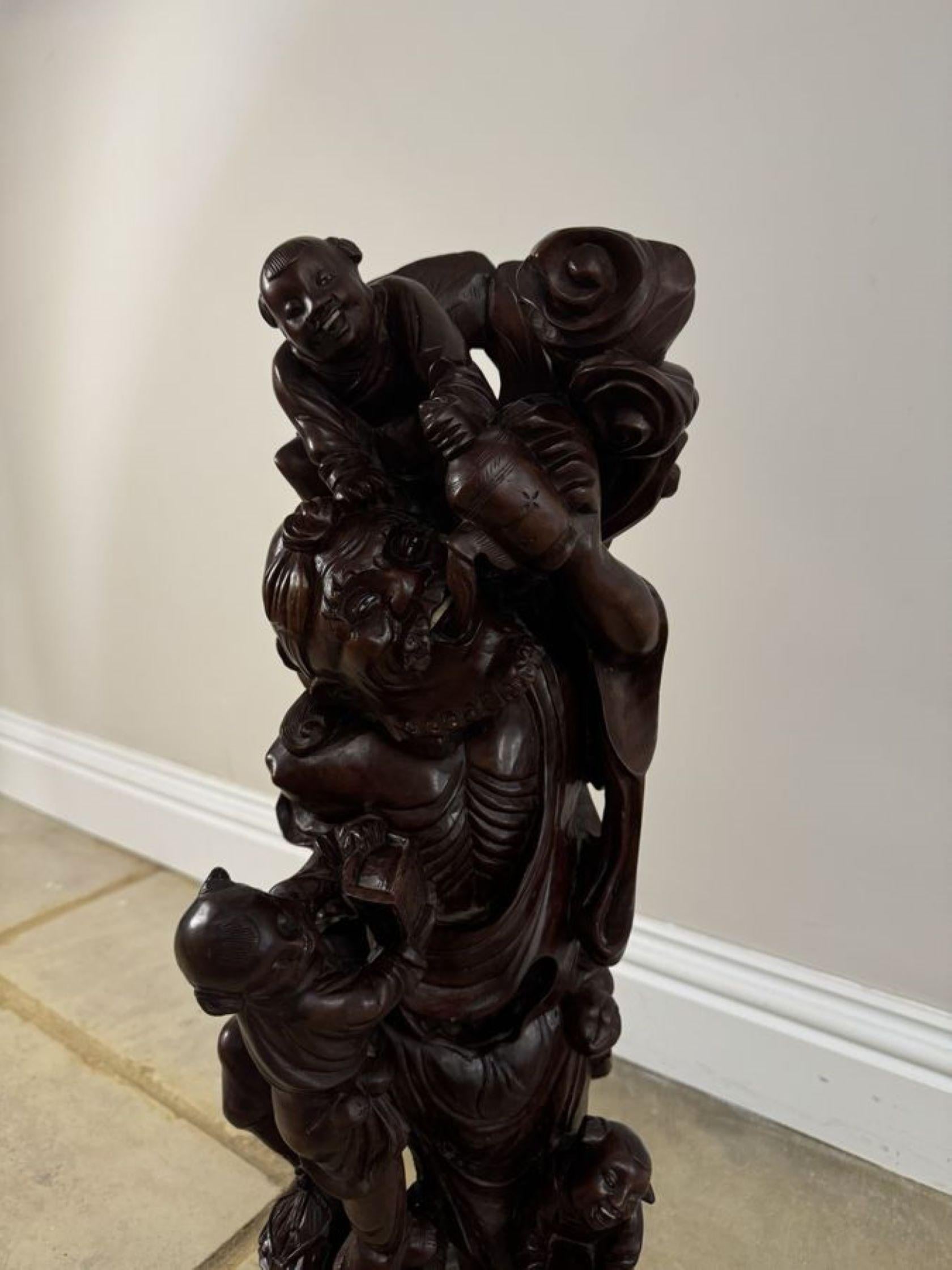 Superb quality large antique carved hardwood Chinese figure, having a outstanding quality carved hardwood figure of a man with three boys upon a carved shaped base. 

D. 1900