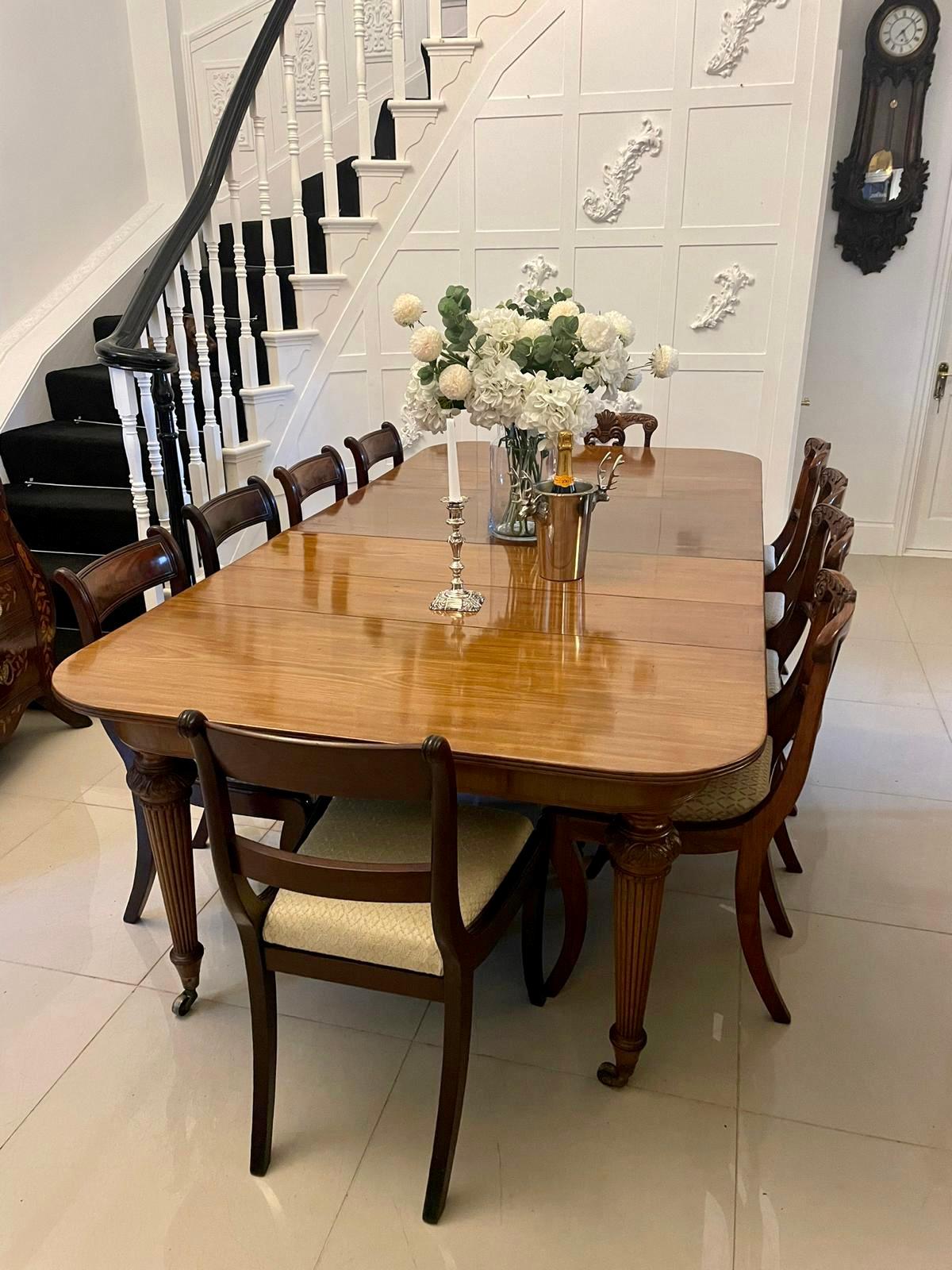 Superb quality metamorphic antique Regency figured mahogany extending dining table having a superb quality figured mahogany top with two original extra leaves with a reeded edge, mahogany frieze, pull out extending action standing on eight elegant