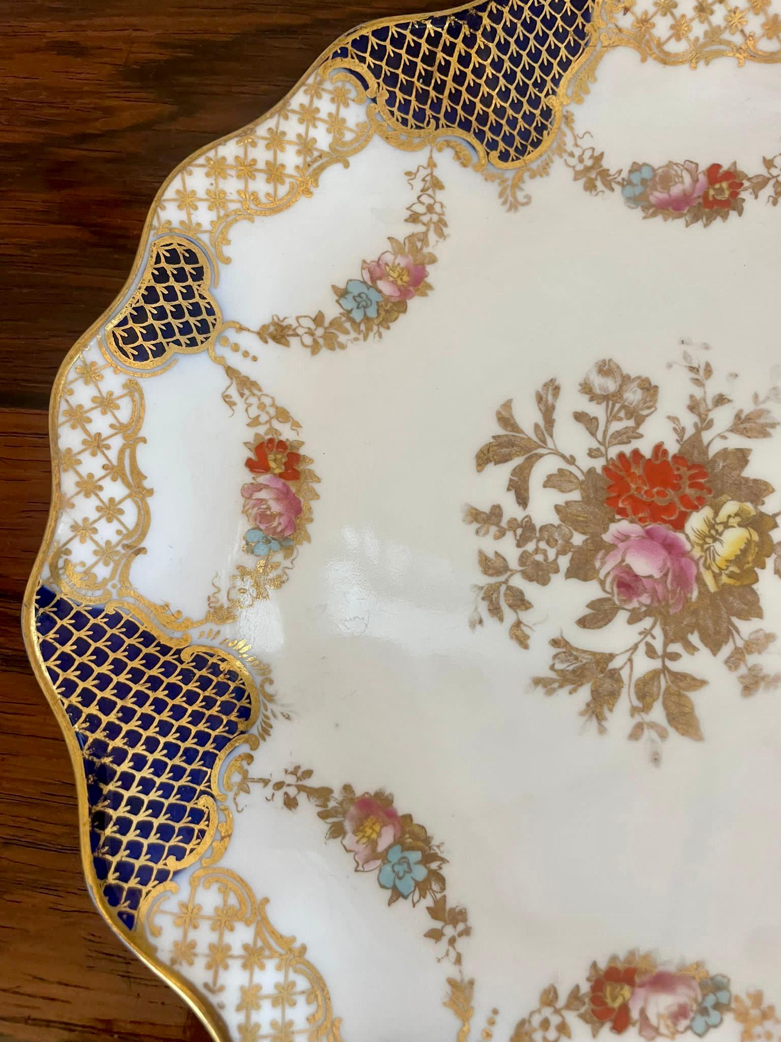 Superb quality pair of antique Edwardian hand painted Wedgwood shaped plates having a pair of antique Edwardian Wedgwood shaped dishes with fantastic quality hand painted decoration in red, pink, yellow, blue and gold colours 


Charming plates in