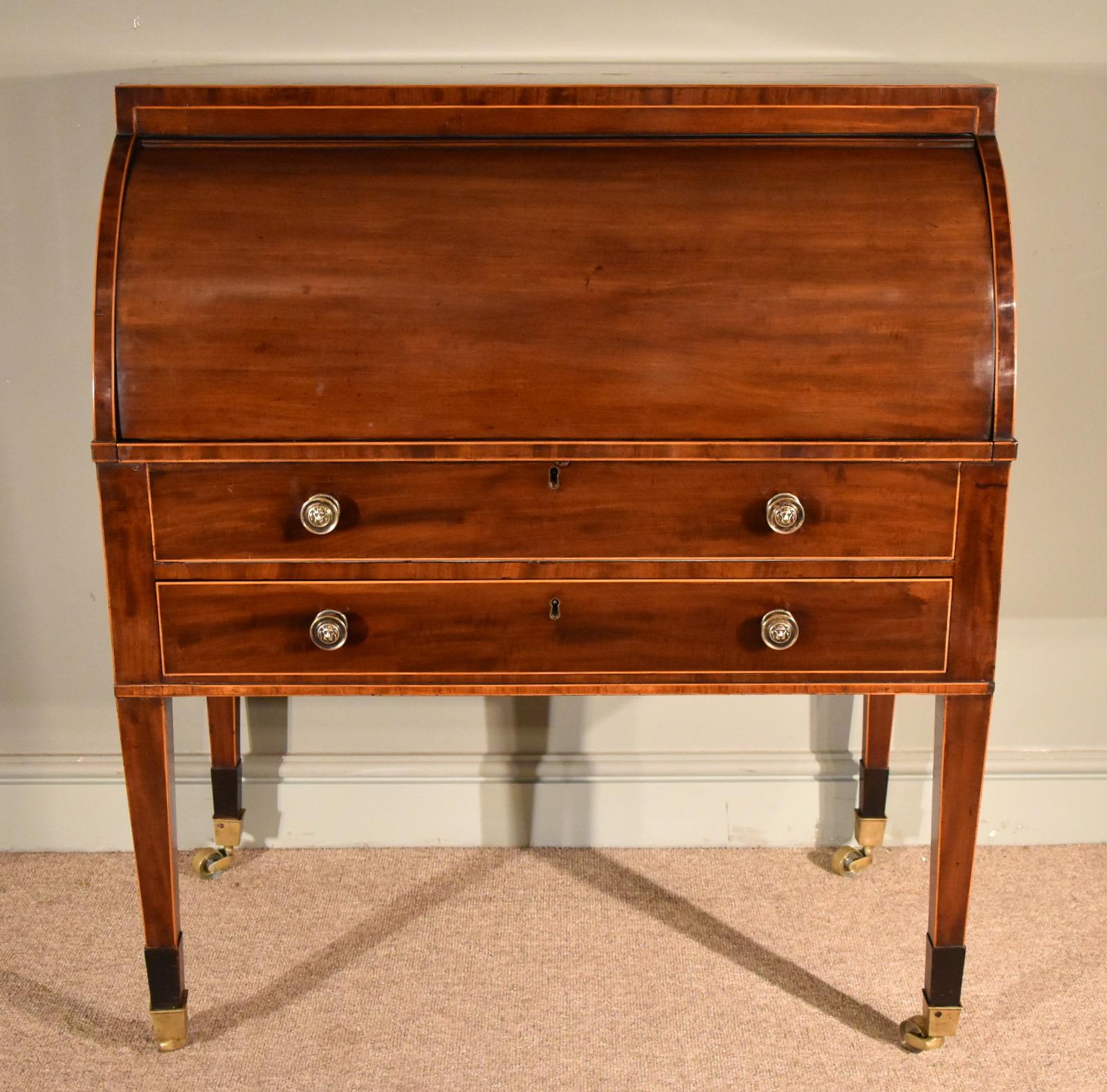 A superb quality late 18th century Sheraton period mahogany and boxwood strong cylinder desk with a fine burr yew interior.

Dimensions:
Height 42” (107cm)
Width 36