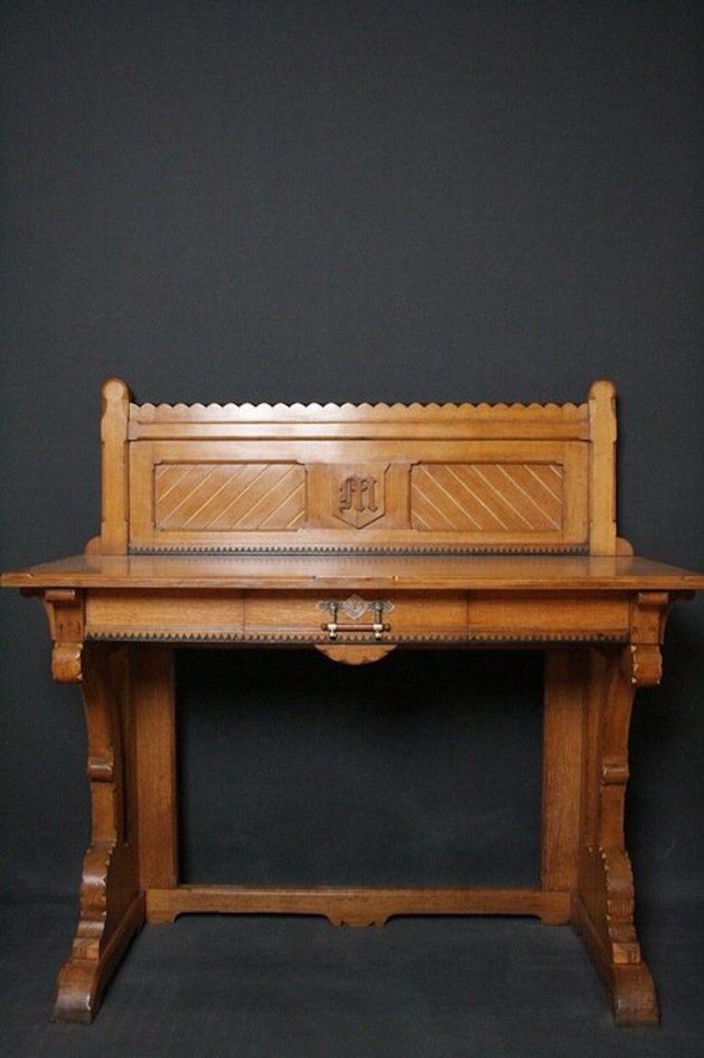 SN1117 Outstanding quality Victorian - Gothic revival hall table, having upstand to back with 2 panels and carved motive to centre, moulded top, single drawer to frieze with impressive, original fitting, all standing on shaped supports, gilded and