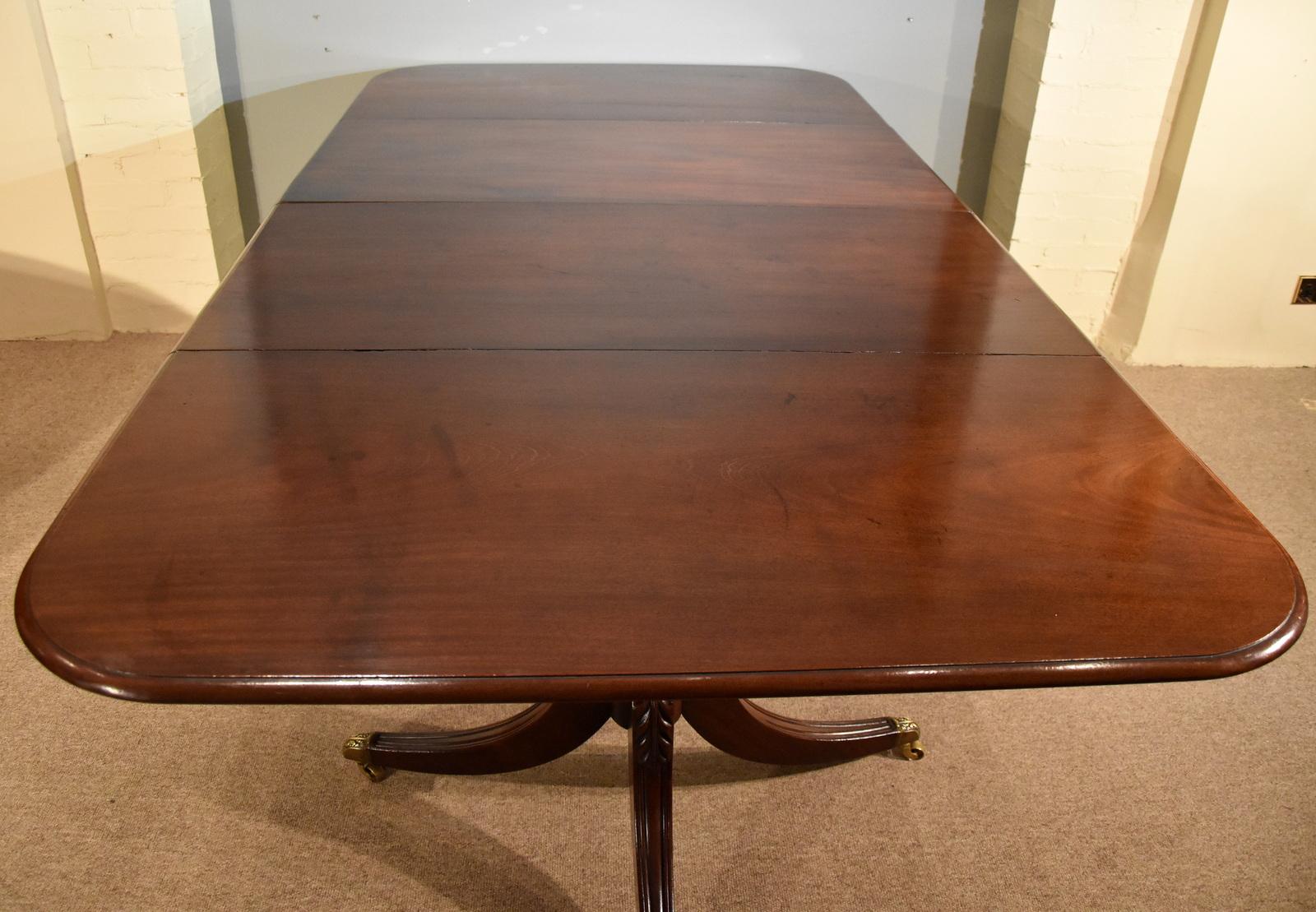 A superb regency two pillar dining table with one later leaf. Two pillar dining tables were only made with one leaf. So bars were introduced to make it possible for two leaves. 

Dimensions
Height 28.5