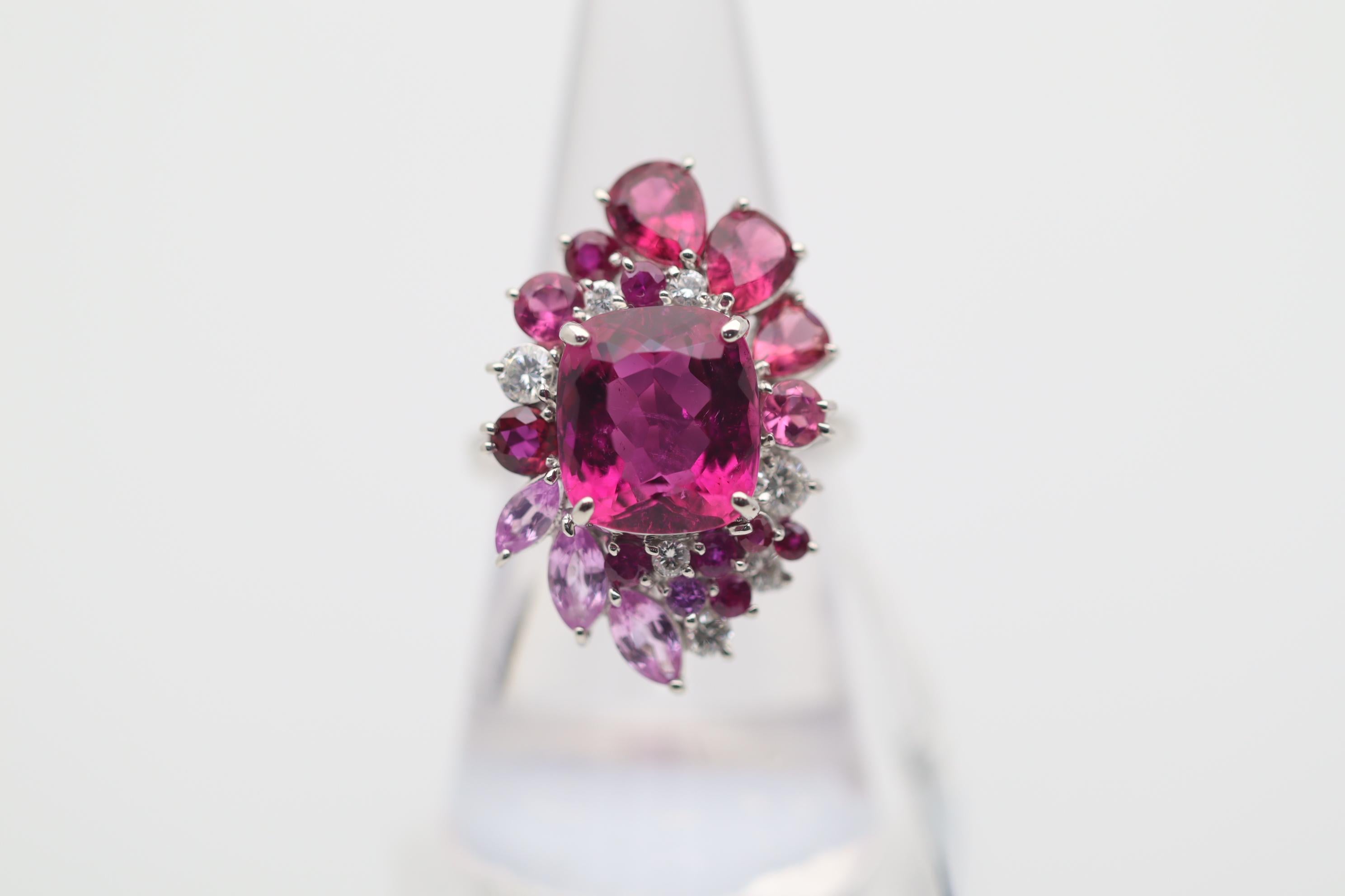 Simply a stunning top-quality piece of fine jewelry. The ring features a 6.29 carat gem rubellite tourmaline with amazing color and clarity. It has an intense and bright raspberry-red color which is completely eye clean with excellent brilliance. It