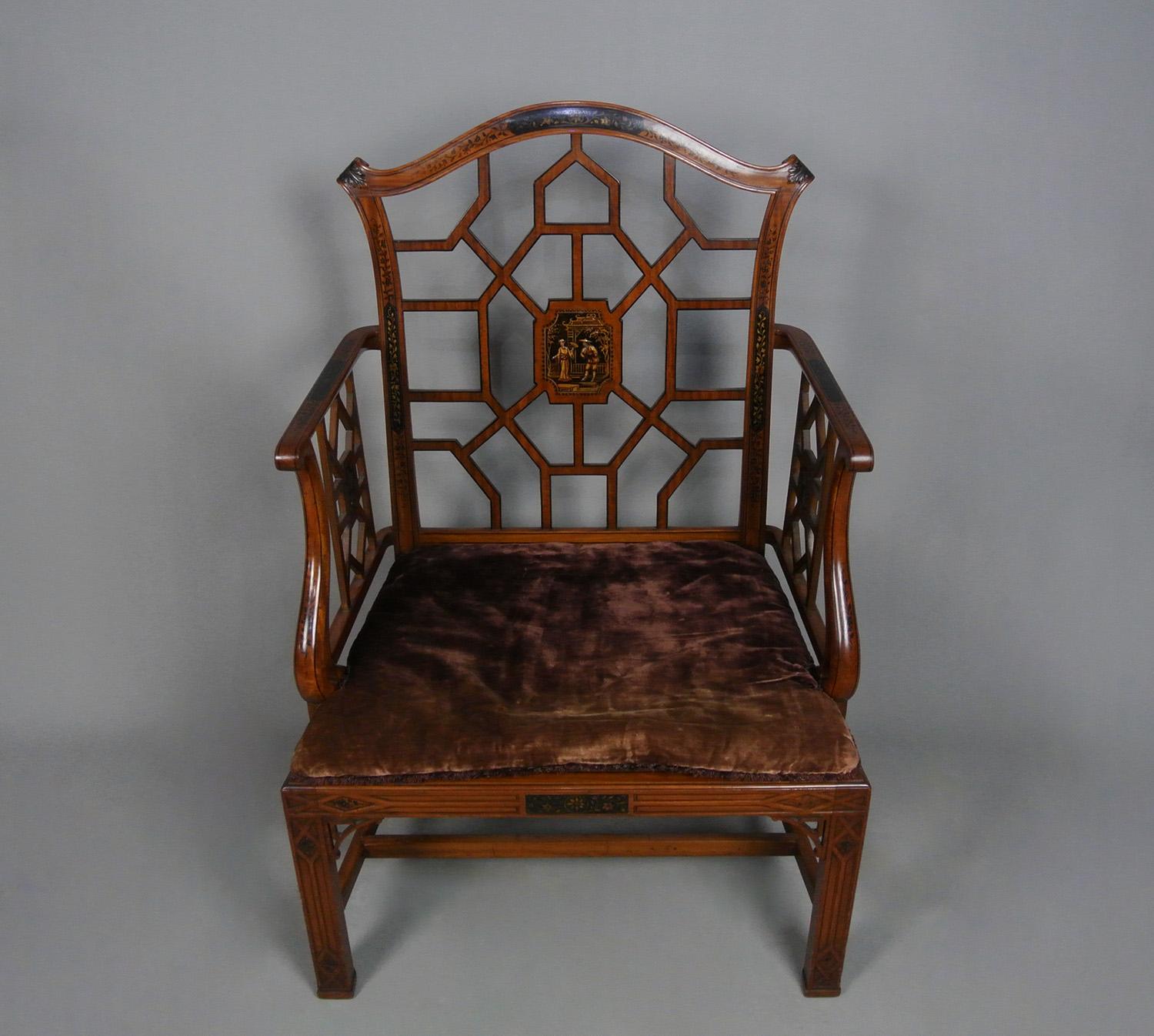 On behalf of a gentleman collector, a most beautiful and capacious satinwood Thomas Chippendale design cockpen armchair.   The whole with hand painted lacquer work panels of chinoiserie design of a courting couple in a Chinese garden, doves, flowers