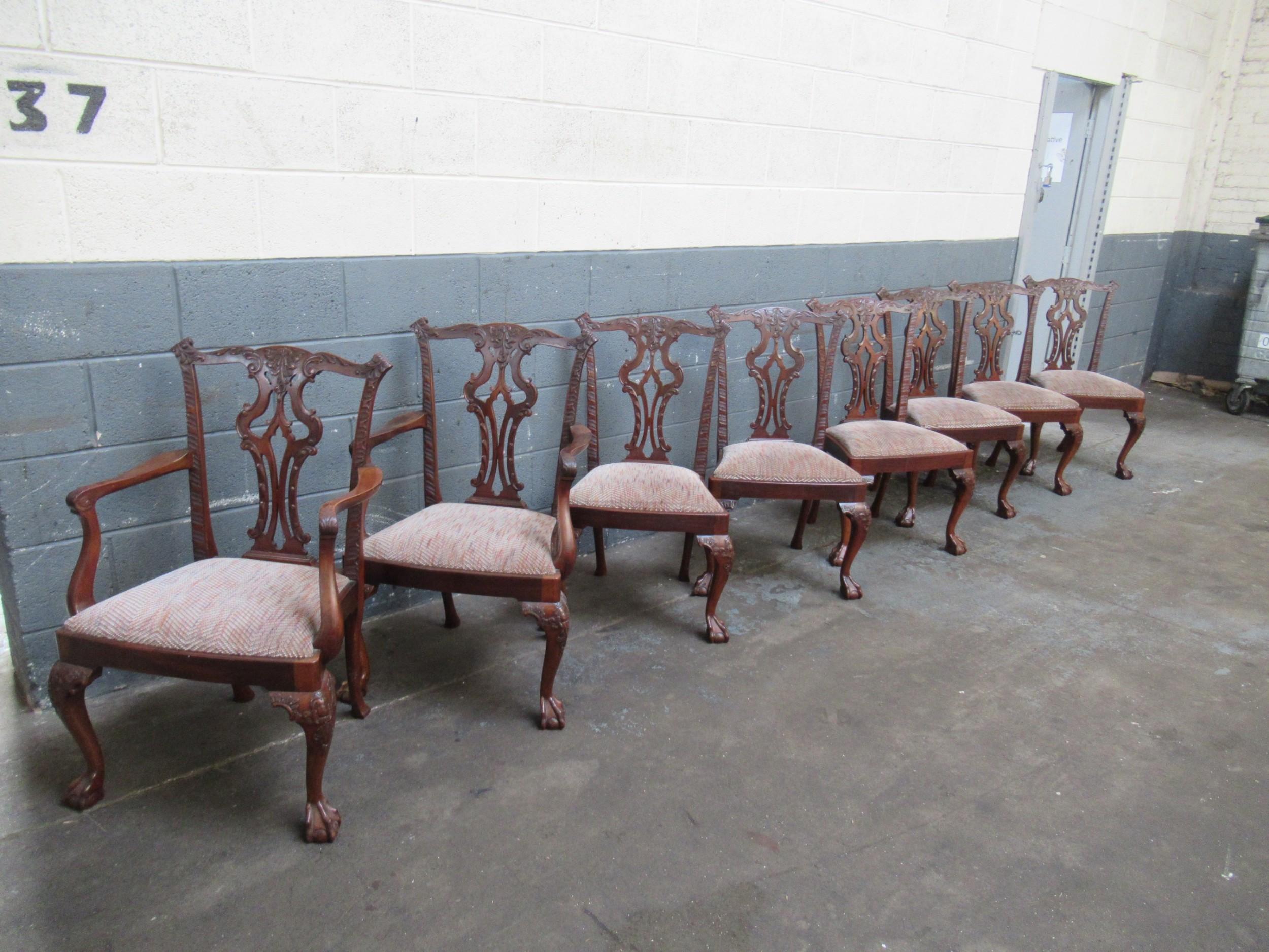 A superb Set of Eight (six side chairs and two armchairs or carvers) Antique English mid-19th century hand carved solid mahogany Chippendale style Dining Chairs.  The crestrail, back splat and stiles are extraordinarily and crisply hand-carved and