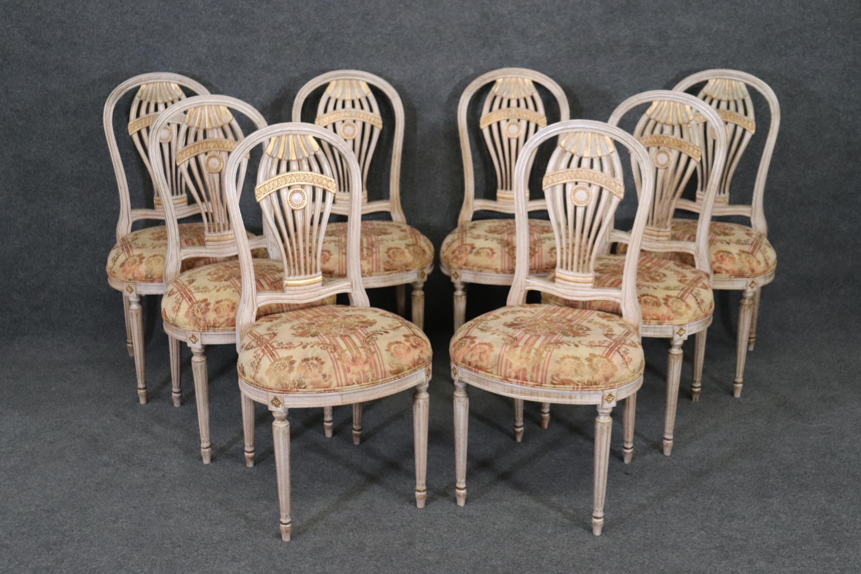 This set of 8 French Directoire Style balloon dining Rroom chairs are made with immense detail and of the highest quality! If you look at the photos provided you'll see the elaborate carved decorations as well as the beautiful upholstery with floral