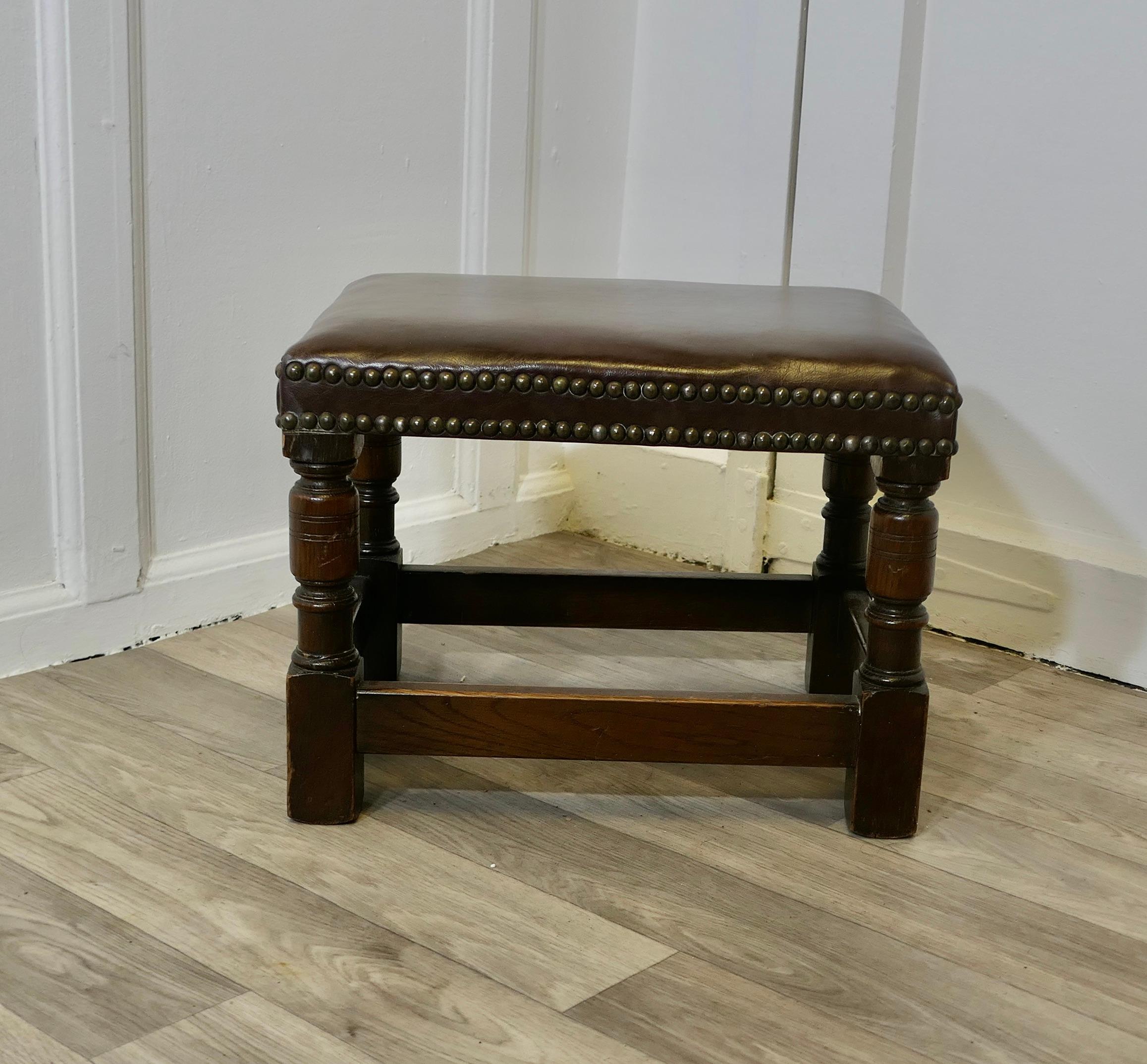 Superb Studded Leather Oak Foot Stool

A Lovely piece, this Victorian stool is made in Oak, it stands on short Turned legs with stretches all round, it has been upholstered in soft Dark Chocolate leather with a double row of brass studs around 
The