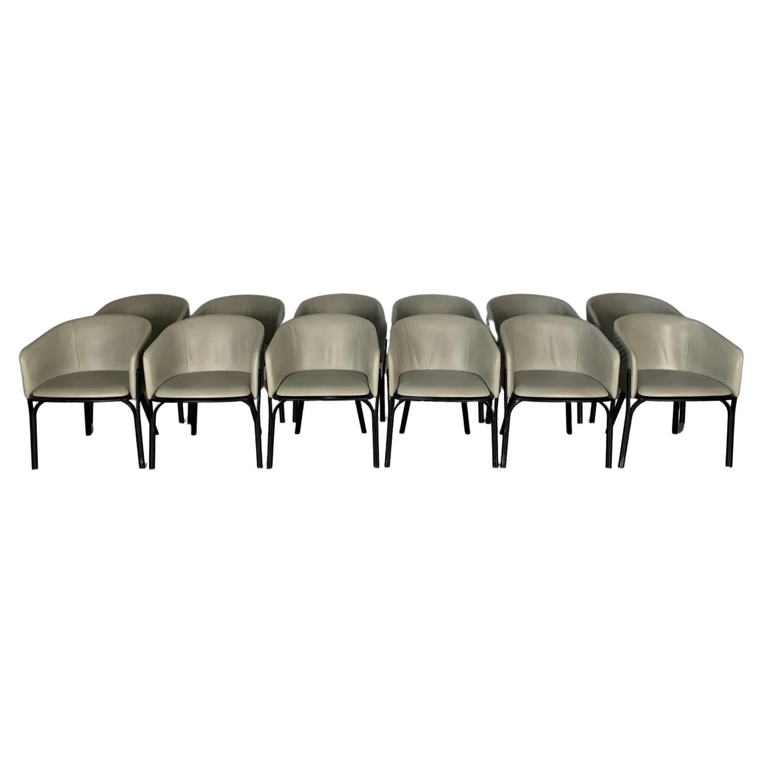 Hervorragende Suite aus 4 tonnen geteilten Sesseln aus Leder und dunklem Wengé im Angebot