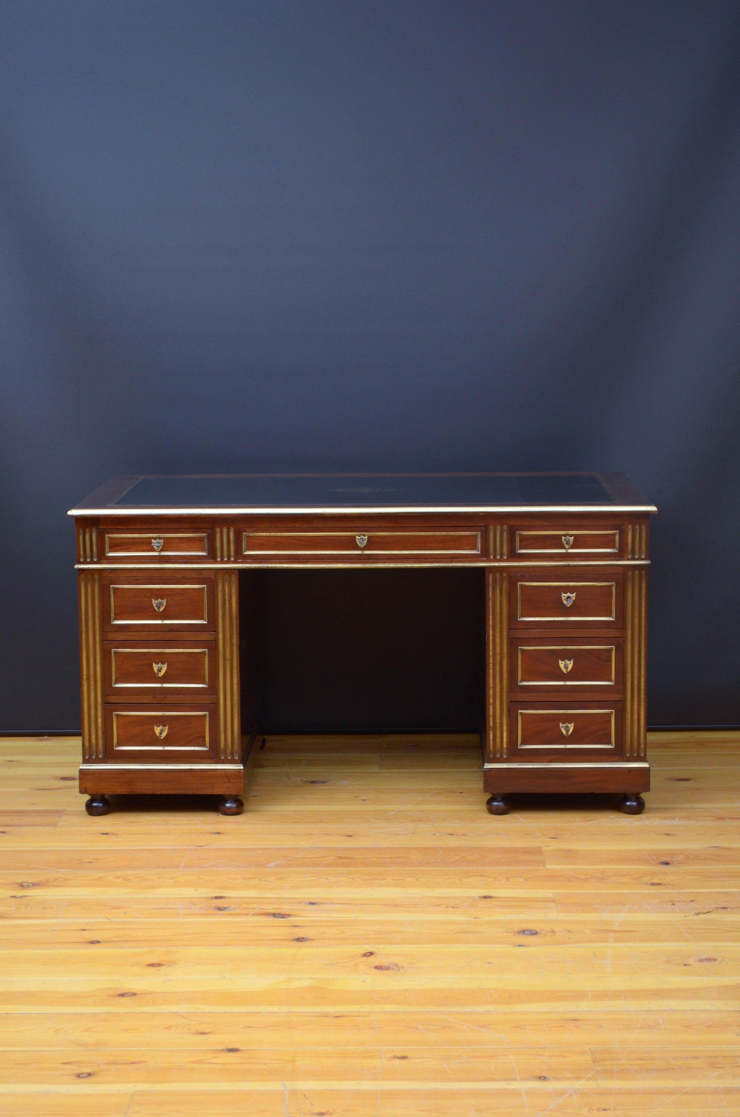 Sn5229 Outstanding turn of the century mahogany pedestals desk, having black tooled leather to the top and two side sliders also with the same leather all showing minor signs of usage, above three oak lined drawers and further three brass moulded