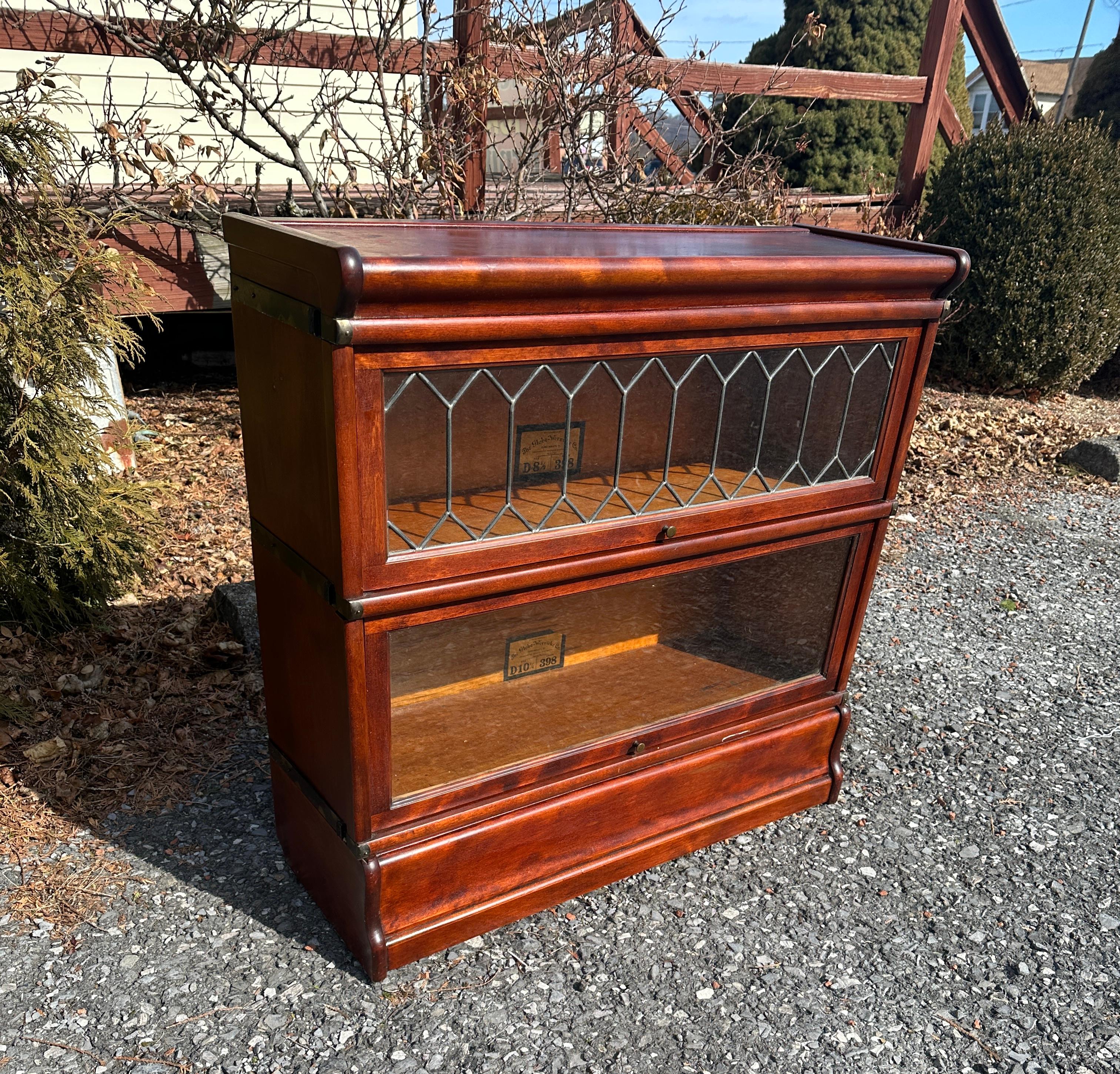 This is a great two-section set of Barrister Cases made by Globe Wernicke Co of Cincinnati, Ohio.  It is their size D10 1/4.  The set is in excellent condition with nice top leaded glass with no damage.  The doors open and close freely.  There have
