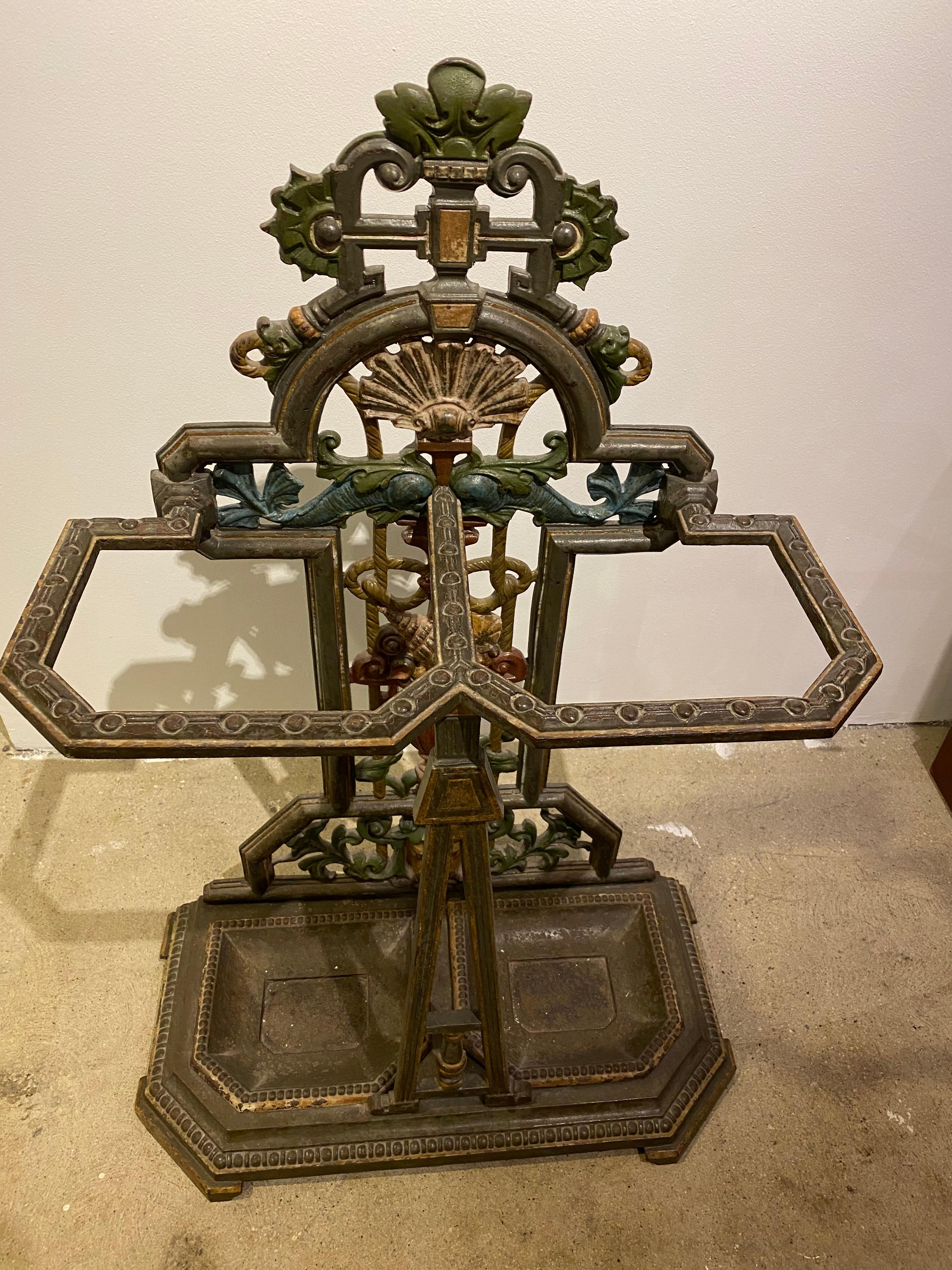 Superb and Unique 19th Century Hand Decorated (Original Paint) Cast Iron Shell & Dolphin Umbrella Stand from England.  Bottom Drip Trays are Removable. 
Circa 1860.  