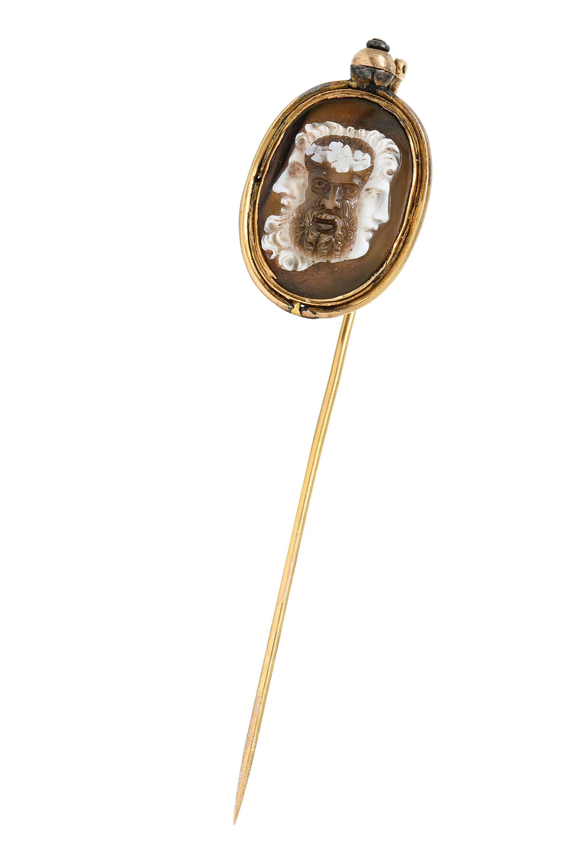 Stickpin features an oval agate tablet measuring approximately 16.8 x 11.8 mm

Translucent with striking white contrasting brown color

Bezel set in a gold surround that can uniquely pivot and rotate to display either side of stone

Both sides are