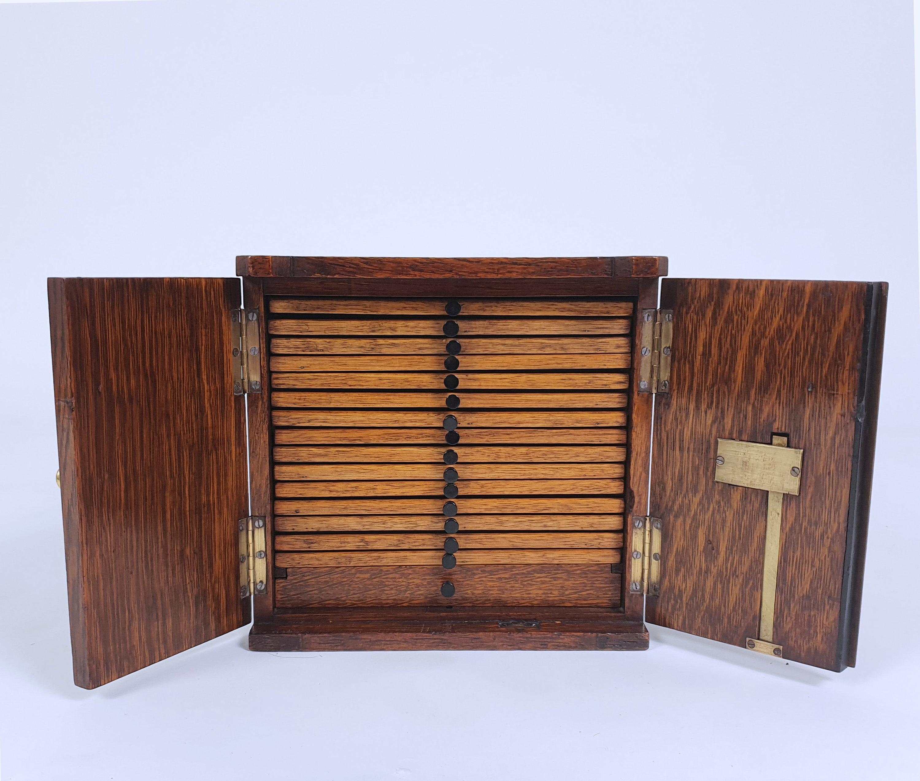 This superb quality Victorian oak collector’s cabinet is in the form of a Chubb safe with brass mounts. The cabinet has 16 drawers, all with embossed handles. It measures 10 in, 25.5 cm wide, 7 ½ in, 19 cm deep and 9 ¾ in, 24.8 cm in height. This