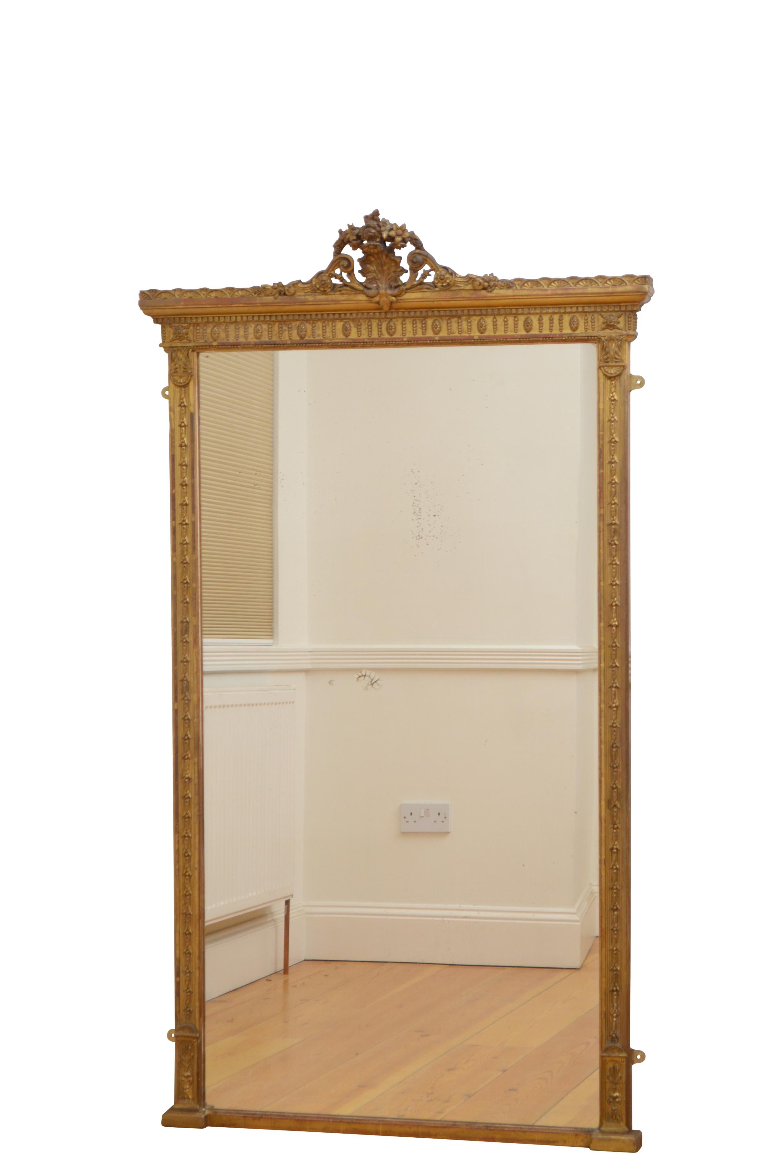 K0419 superb tall and slim Victorian pier giltwood mirror, having original glass with some imperfection in finely hare bells carved and decorated frame with floral centre cresting to the top. This antique mirror retains its original glass, original