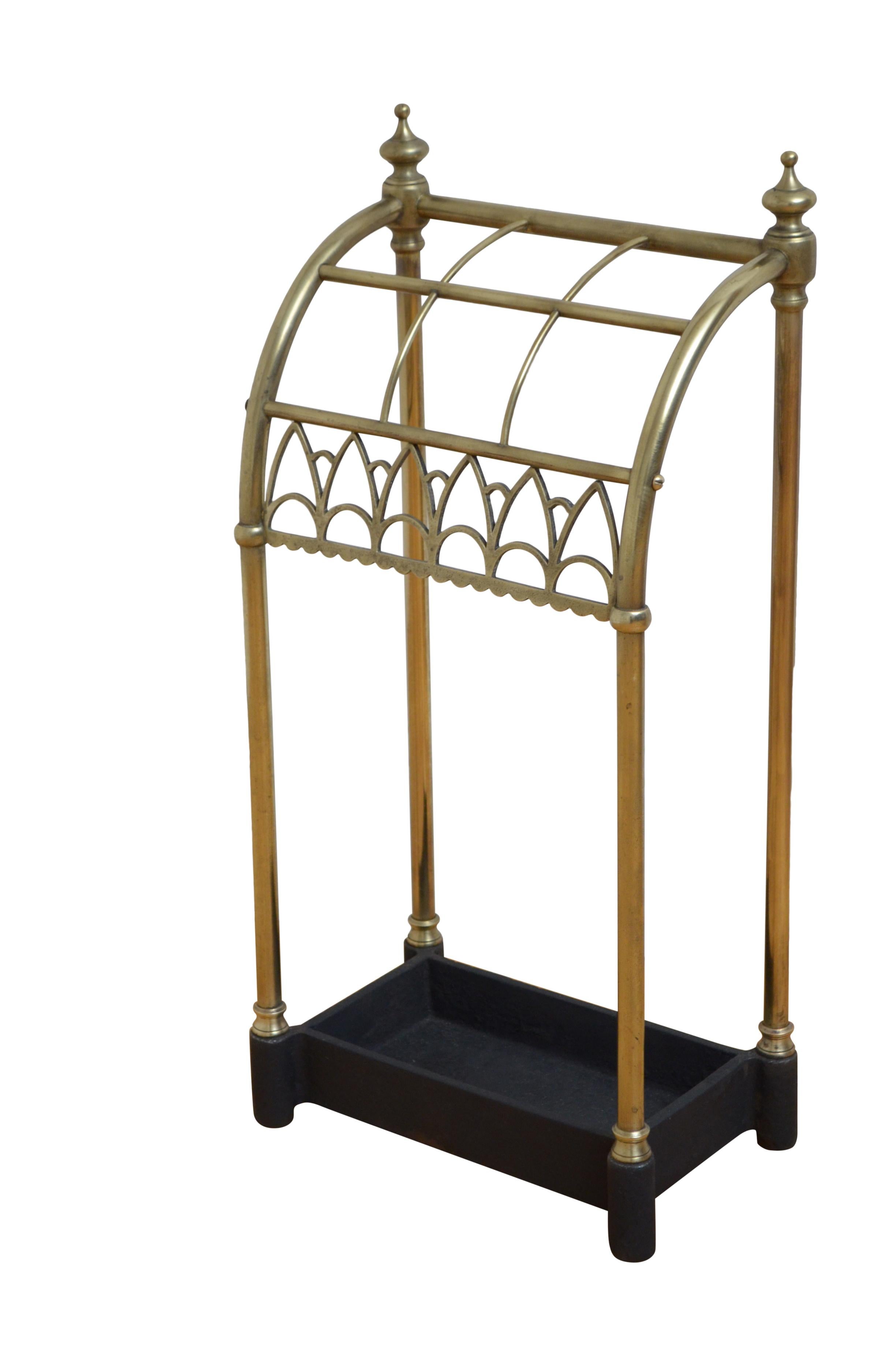 K0572 Very unusual Victorian brass umbrella stand with six divisions, finials and decorative fretwork to the front all terminating in drip tray. This antique umbrella stand has been cleaned and polished and is in home ready condition. c1870
H25