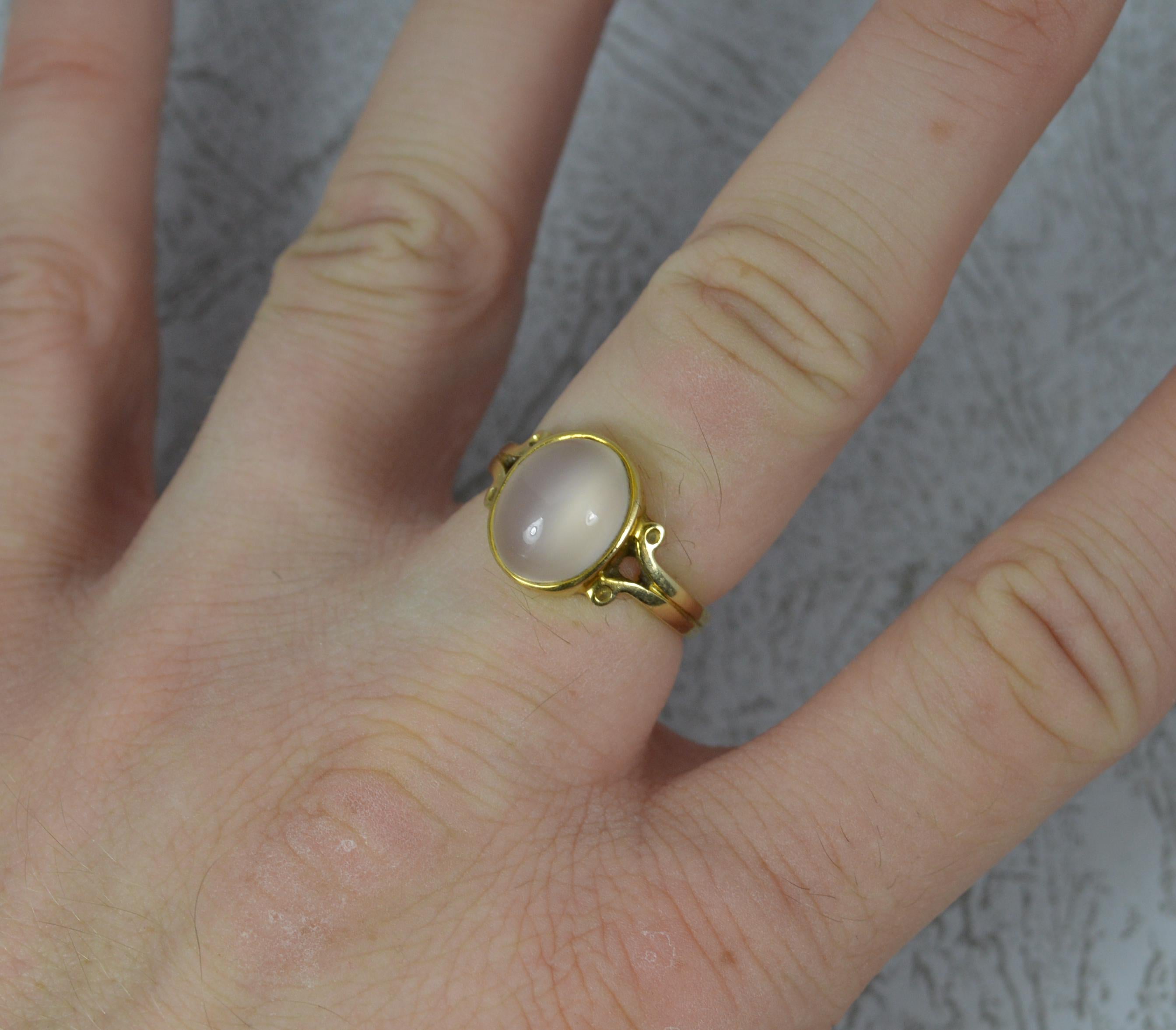 A superb vintage ring.
Solid 14 carat yellow gold example.
Set with an oval shaped moonstone. 9.2mm x 11.4mm approx.

CONDITION ; Excellent. Well set stone. Clean and solid band. Issue free. Please view photographs.
WEIGHT ; 3.8 grams
SIZE ; N UK, 6