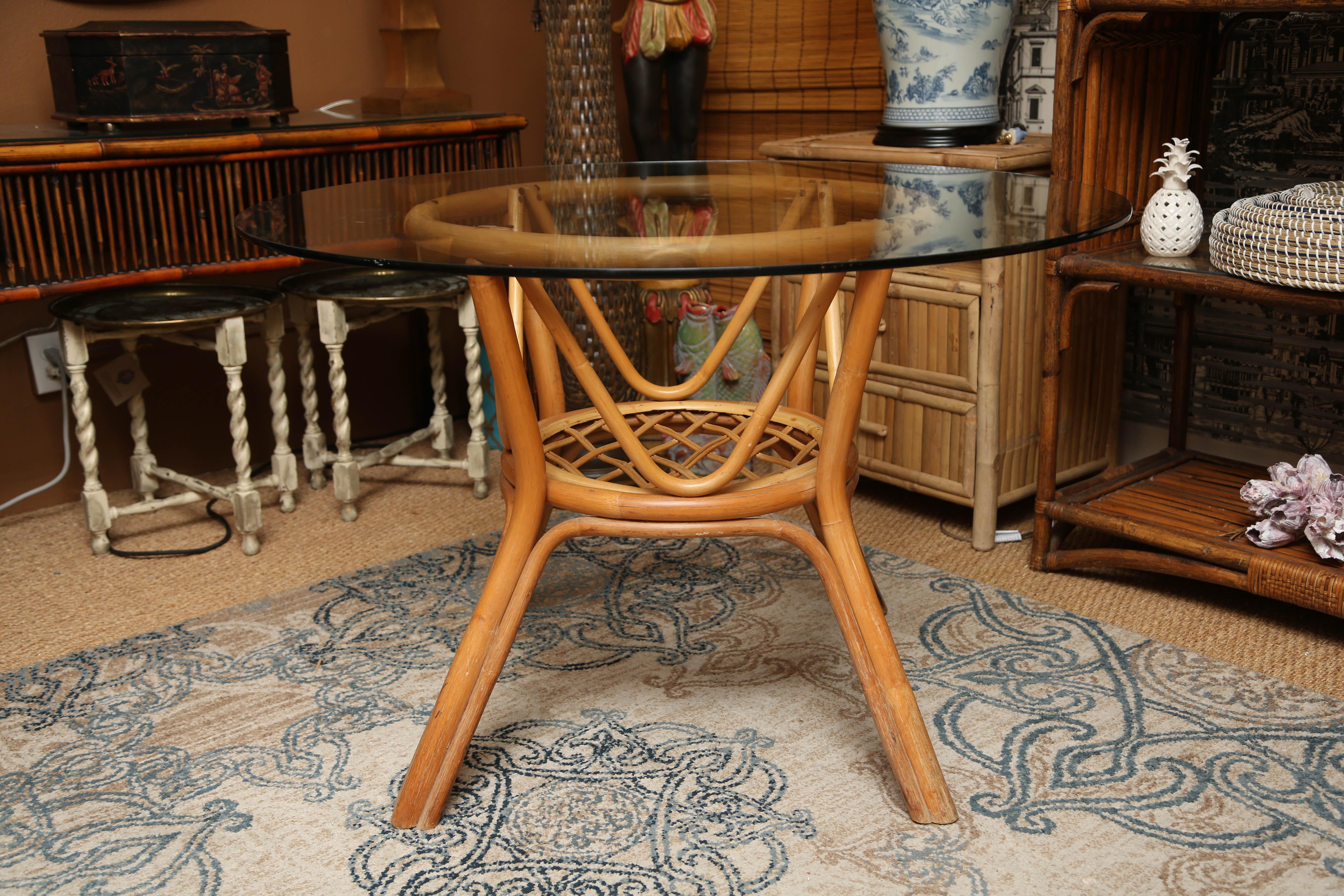 Superb vintage Rattan centre table with four chairs.
Table H 42, W 34.