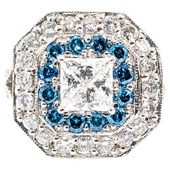 Superbe bague fantaisie avec diamants blancs et bleus