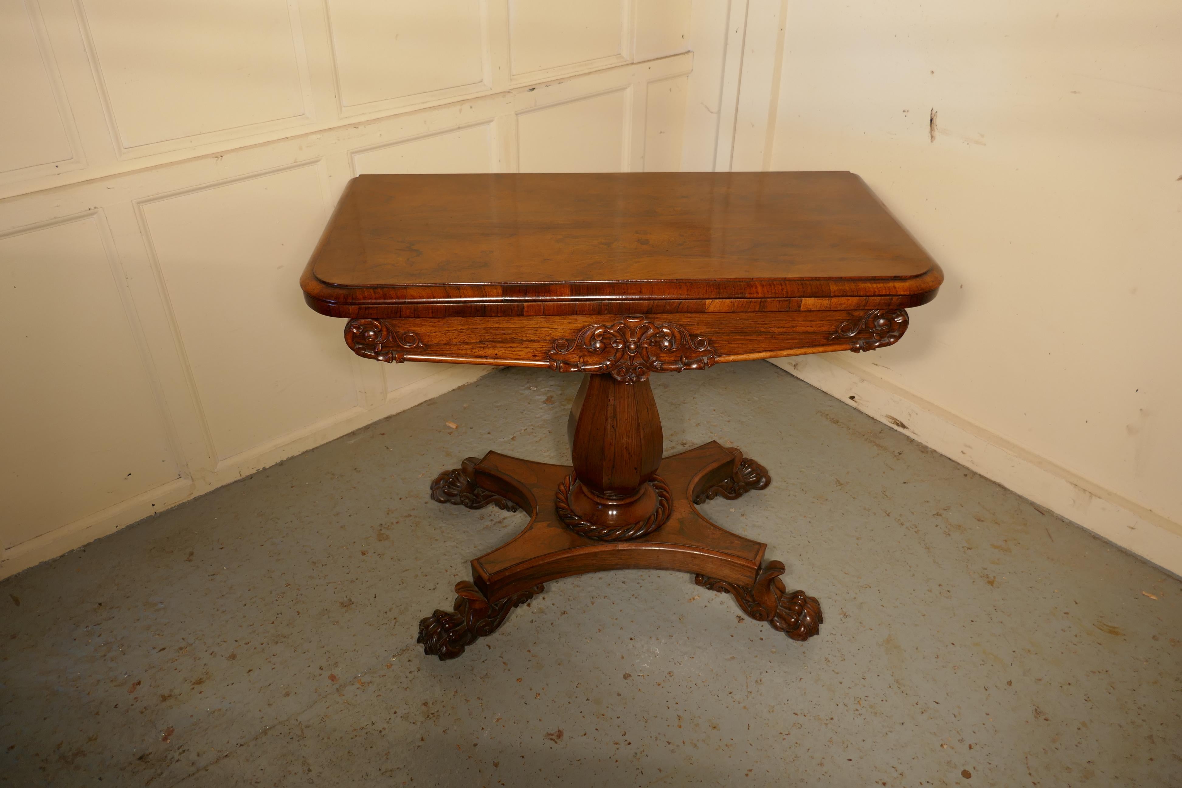 Superb WilliamIV Folding Games or Card Table

This is an exceptionally fine quality piece with beautiful patina, it takes up little space and unfolds to a 3ft square games table
The base leg and apron of the table are carved and decorated, the table