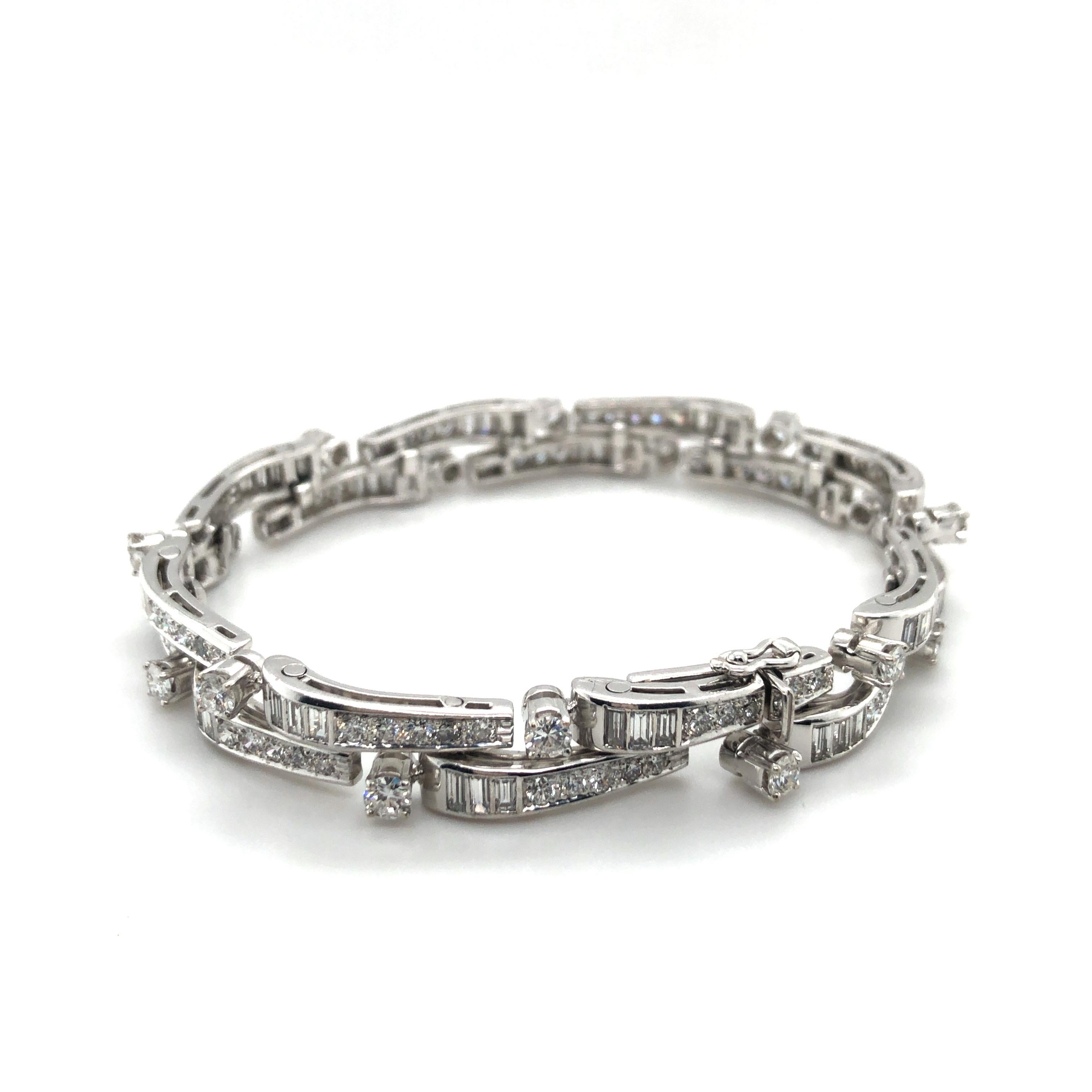 Simply stunning, our diamond bracelet has a magnificent shine from round and baguette-cut diamonds, which are set in 18K white gold. 
48 baguette-cut diamonds totalling approximately 2.40 ct and 96 brilliant-cut diamonds with a total weight of