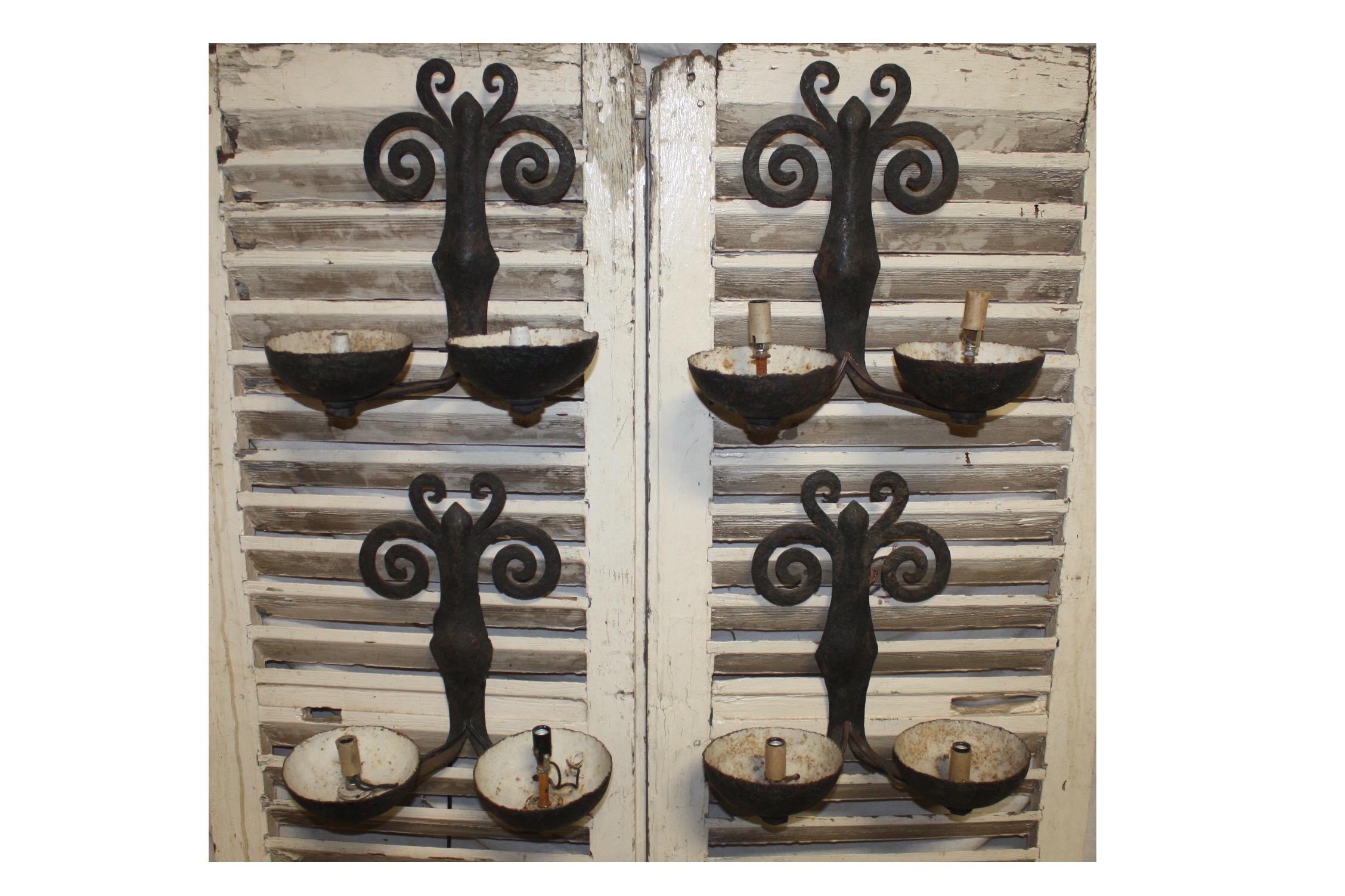 Superbe French pairs of iron sconces.