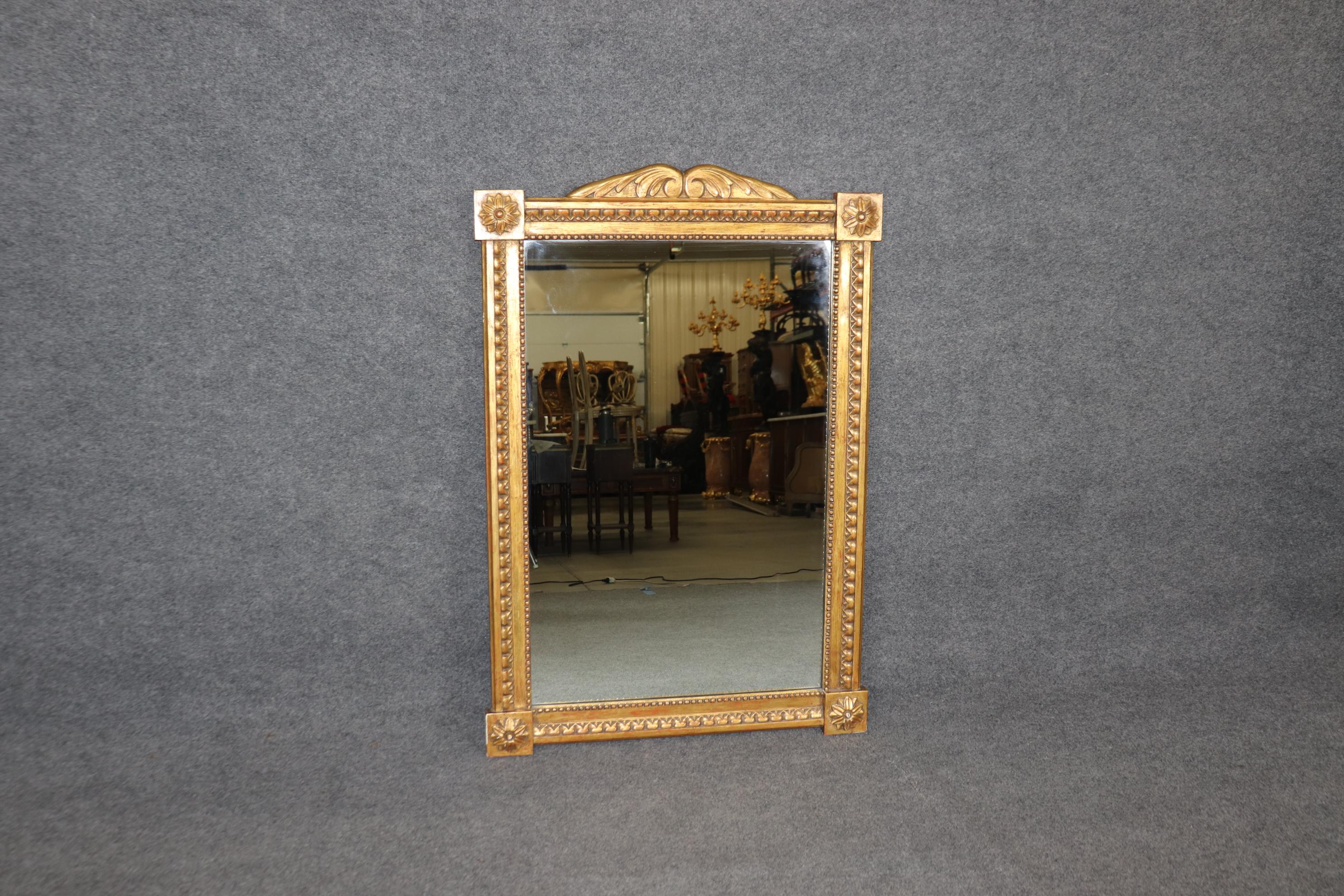 This is a rarity amongst American made furniture manufacturers and the ones espcially who treasured making exact replicas of European classics. This gorgeous mirror is in genuine gold leaf and is stamped Don Ruseau on the back. The mirror is in good