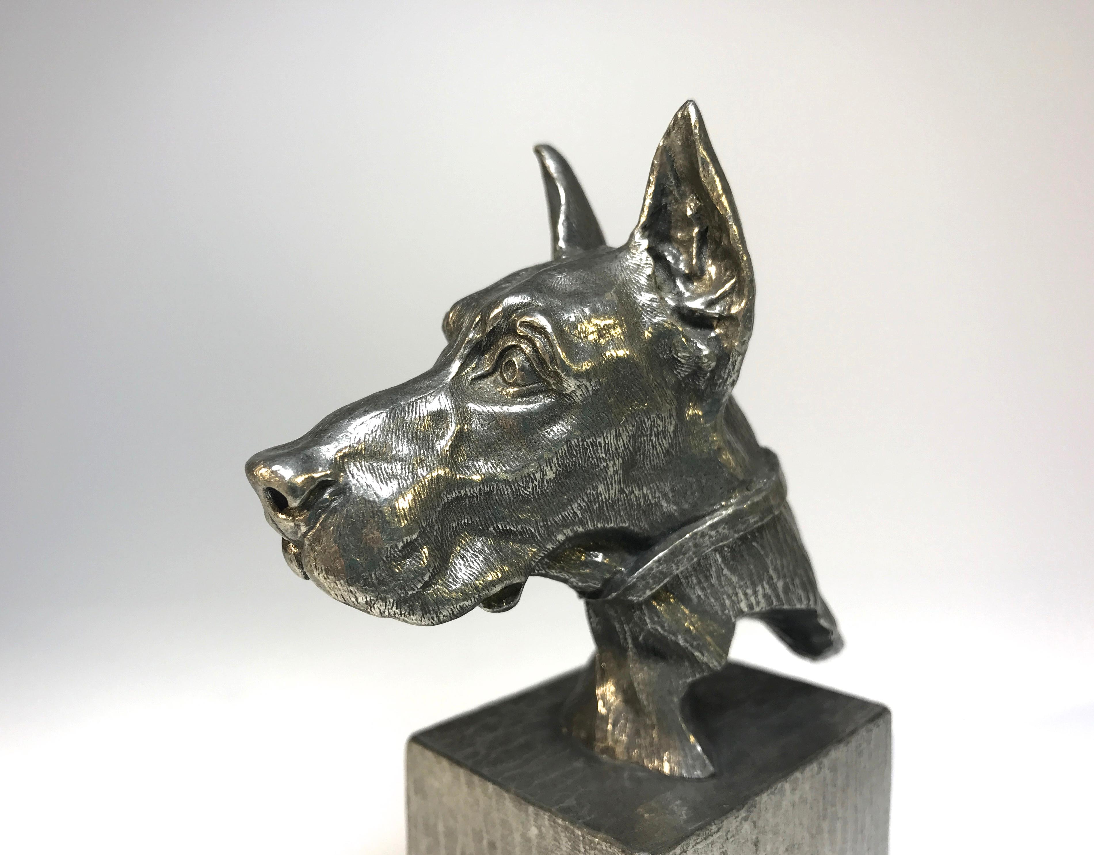 Superbly cast vintage pewter Great Dane bust midcentury paperweight 
The fine detailing on this pedigree piece makes for a super desk accessory
Measures: Height 3.75 inch, width 1.5 inch, depth 1.75 inch
In excellent condition.
 