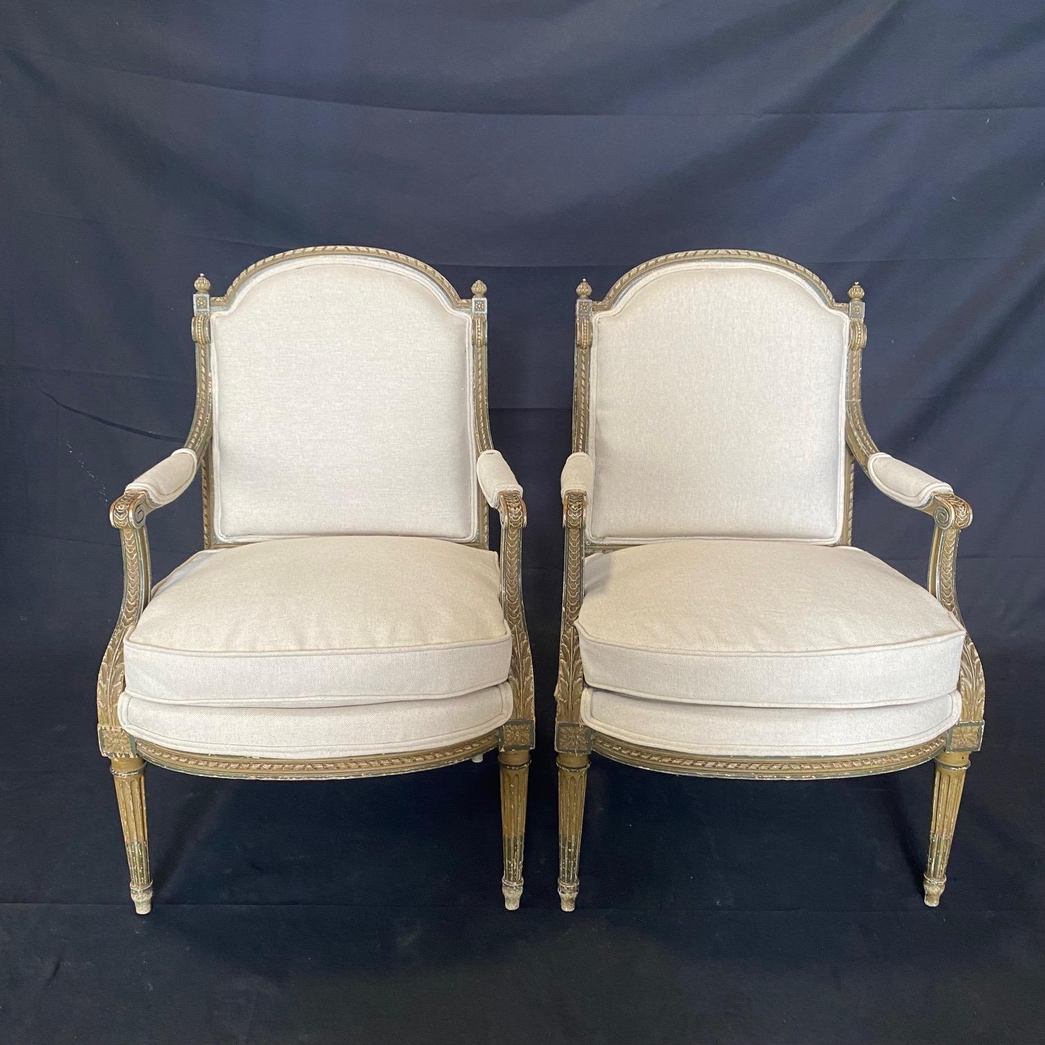 Gorgeous and sturdy French 19th century sofa and pair of armchairs fauteuils, all newly reupholstered in a neutral high quality linen cotton blend that accents the detail in the Louis XVI classic form with stunning carved fluting to the backs, arm