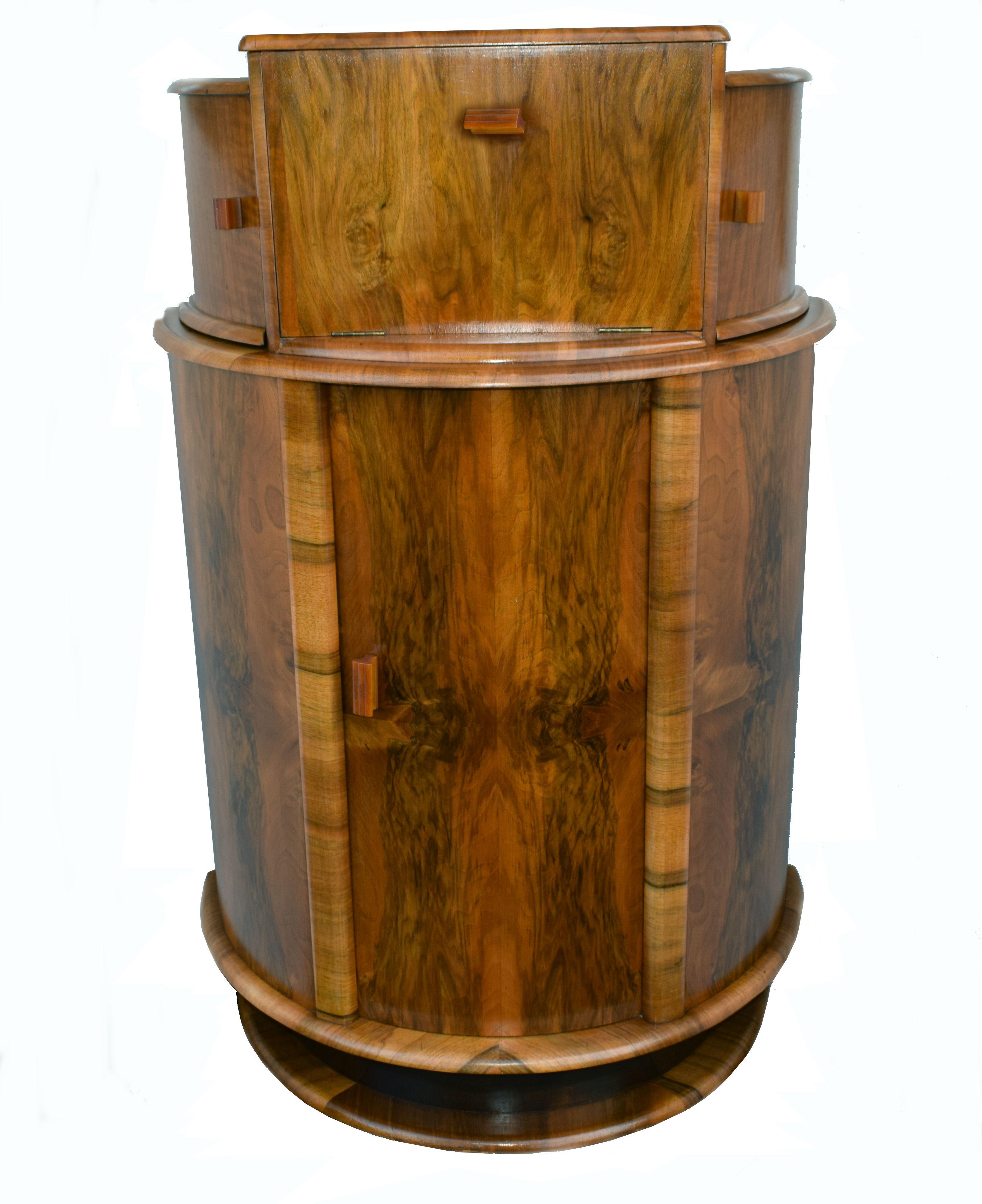 For your consideration is this fabulously stylish 1930s Art Deco cocktail cabinet. Wonderful and an unusual shape being of a half circular drum form. This cabinet dates from the 1930s and has all the bells and whistles you want from a cocktail