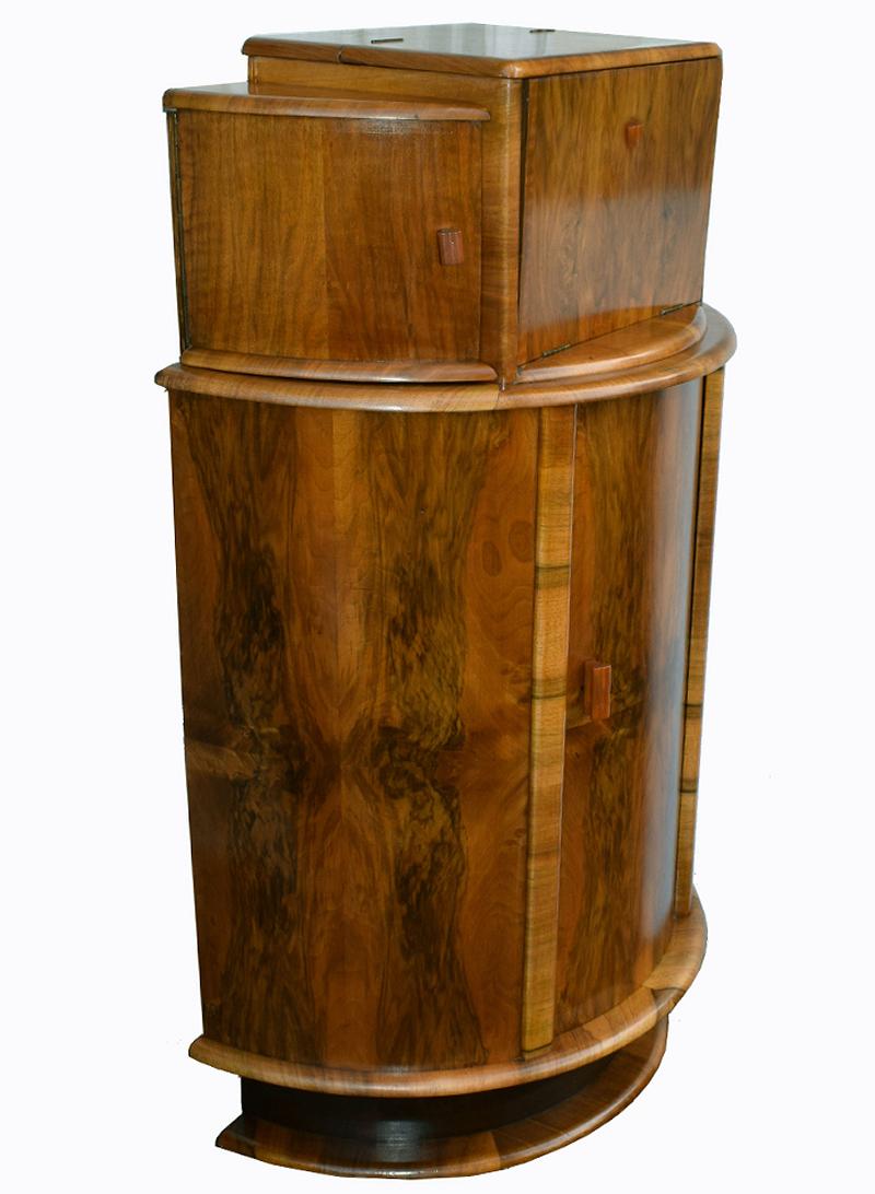 For your consideration is this fabulously stylish 1930s Art Deco cocktail cabinet. Wonderful and an unusual shape being of a half circular drum form. This cabinet dates from the 1930s and has all the bells and whistles you want from a cocktail
