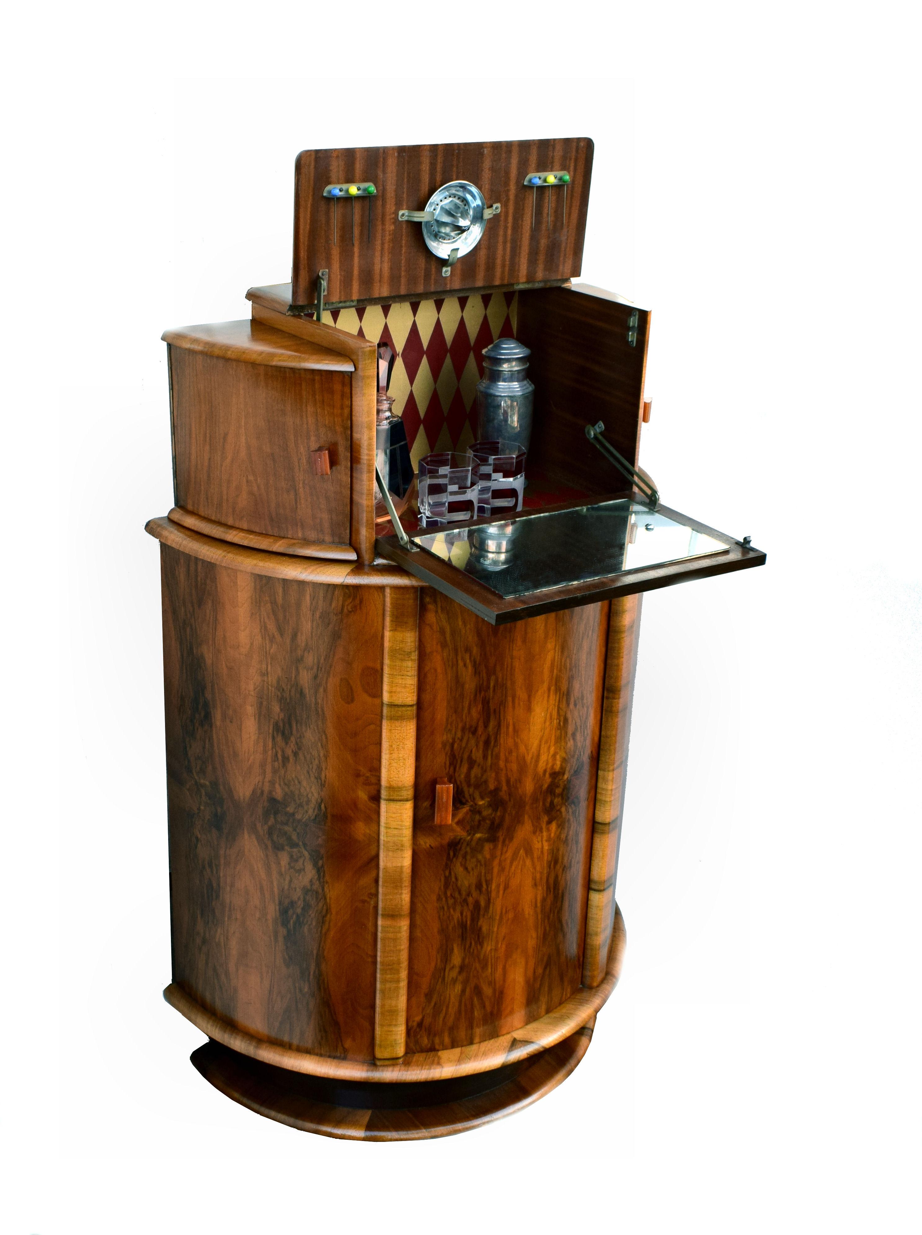 For your consideration is this fabulously stylish 1930s Art Deco cocktail cabinet. Wonderful and an unusual shape being of a half circular drum form. This cabinet dates from the 1930s and has all the bells and whistles you want from a cocktail
