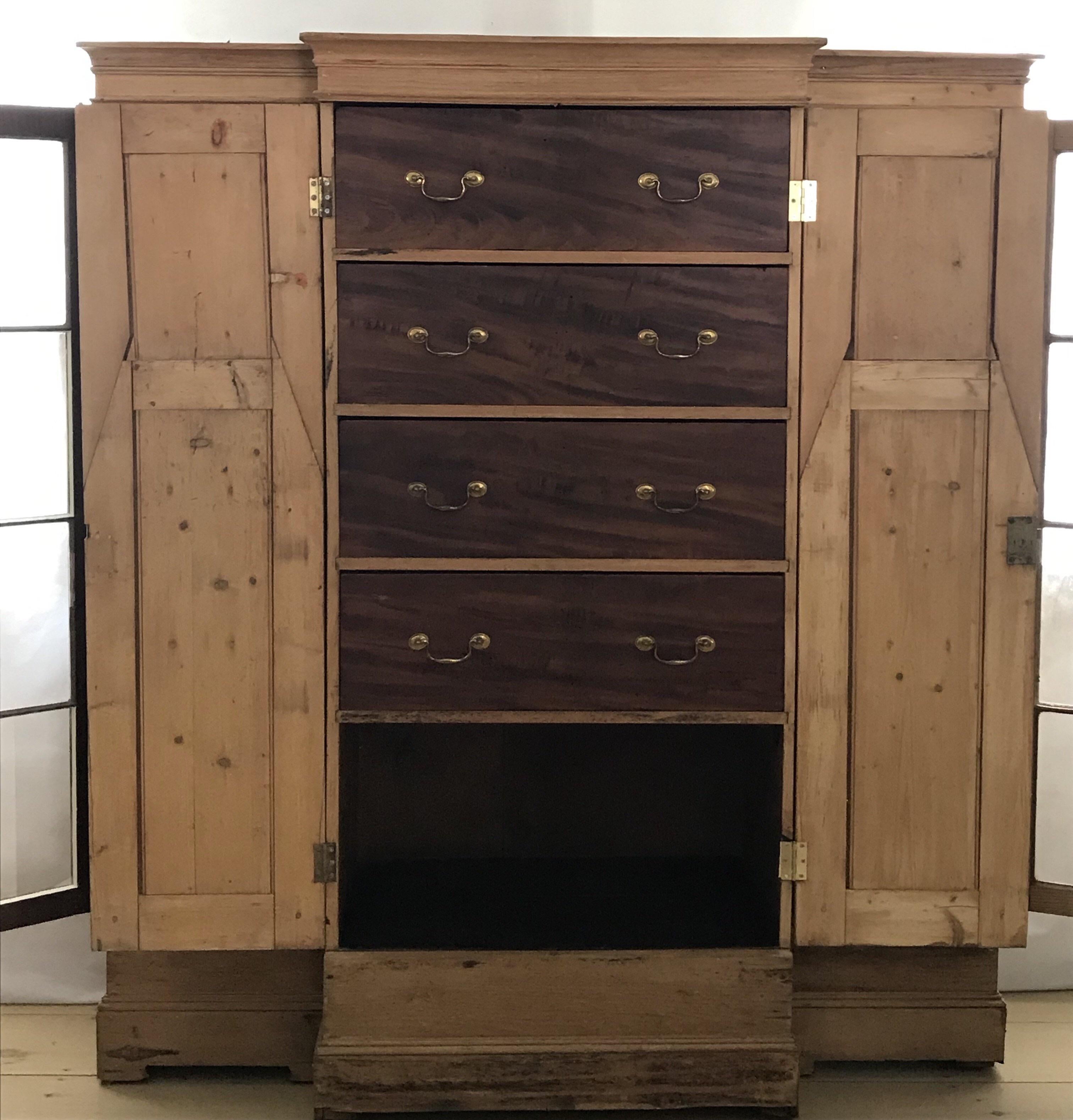 Superb quality early 19th century pine Scottish solicitors cabinet armoire having a base section with four beautifully faux painted drawers over an open shelf behind two doors, with separate side sections that house eight shelves for books. This