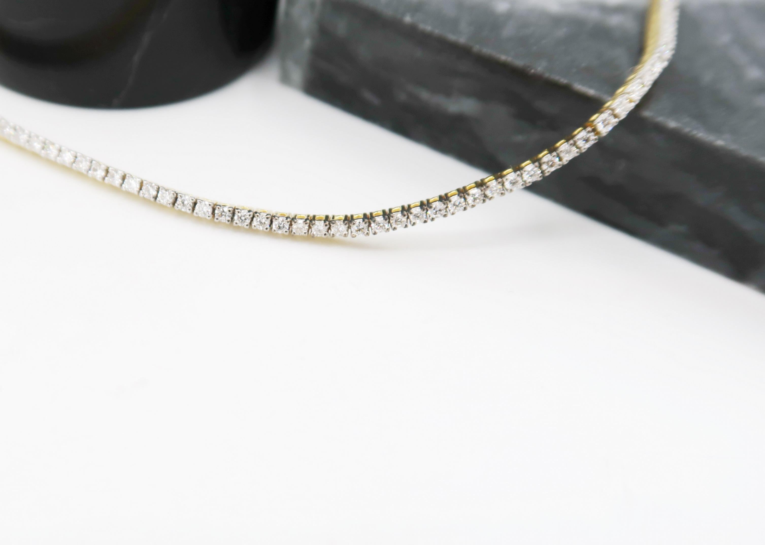 Superfine Delicate Thin Diamond Tennis Bracelet in 18 Karat Yellow Gold

Delicacy that can be worn on its own or stacked with a watch and/or other bracelets.
Also available in 18K White Gold (LU820311544062)

Gold: 18K Yellow Gold 4.60 g
Diamond: