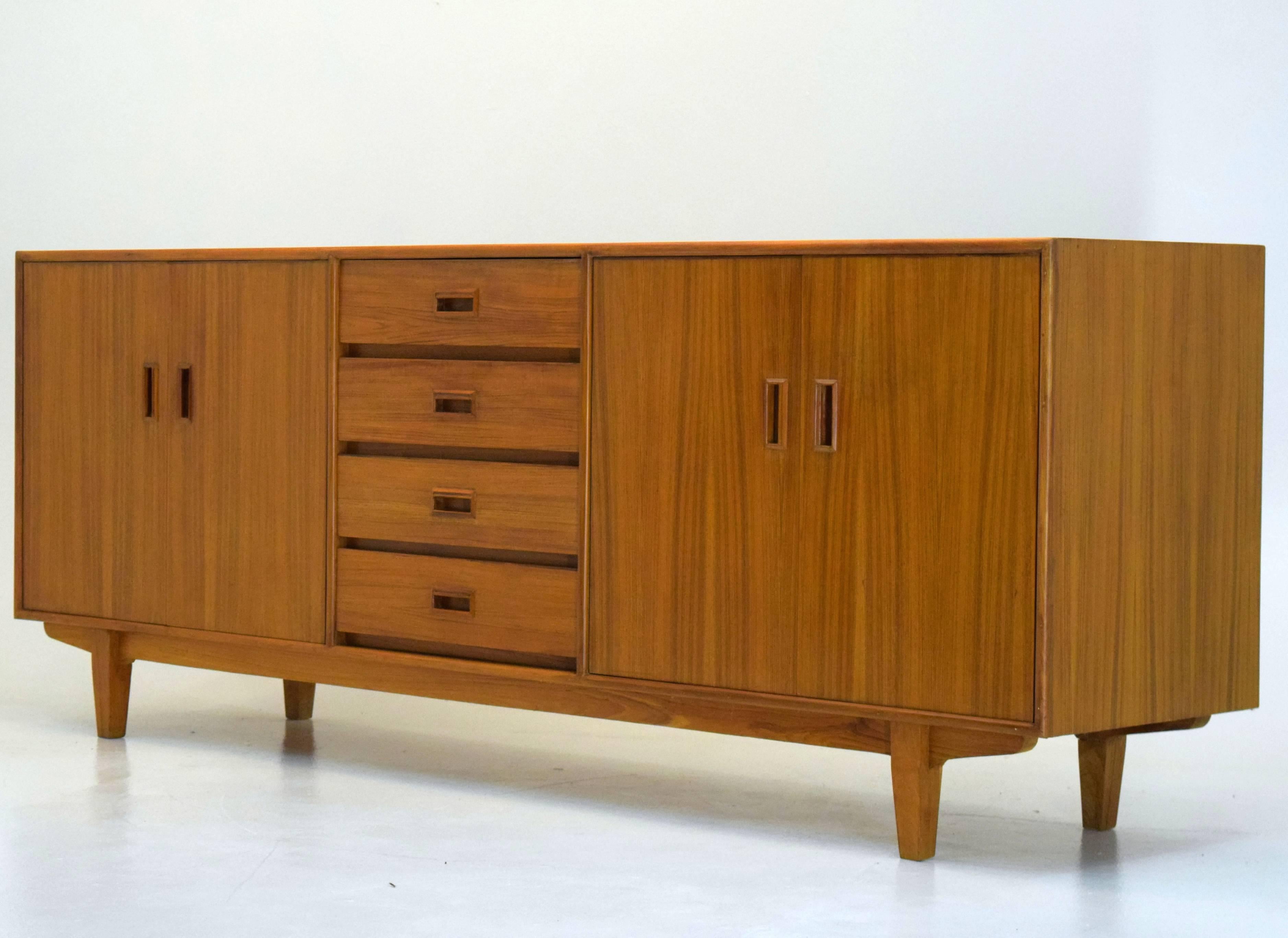 Denmark, circa 1970. Teak. Designer and cabinetmaker unknown, in the style of Borge Mogensen. Measures: 84 wide x 31 tall x 18.5 inches deep. Custom built and a one of a kind unique piece. The condition is excellent. It is exceptionally well built
