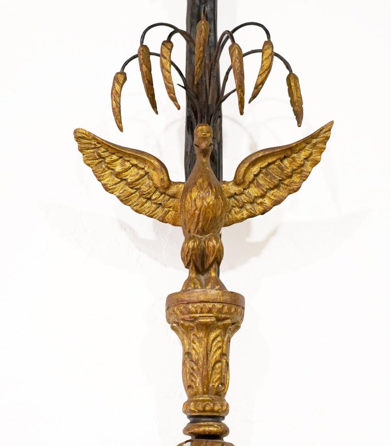45 inches tall these Italian wall sconces fashioned in the Louis XVI style feature stems in the form of folded silk ending in tassels and surmounted by ribbons. The central motifs are carved imperial giltwood eagles accented by gilt metal leaves.