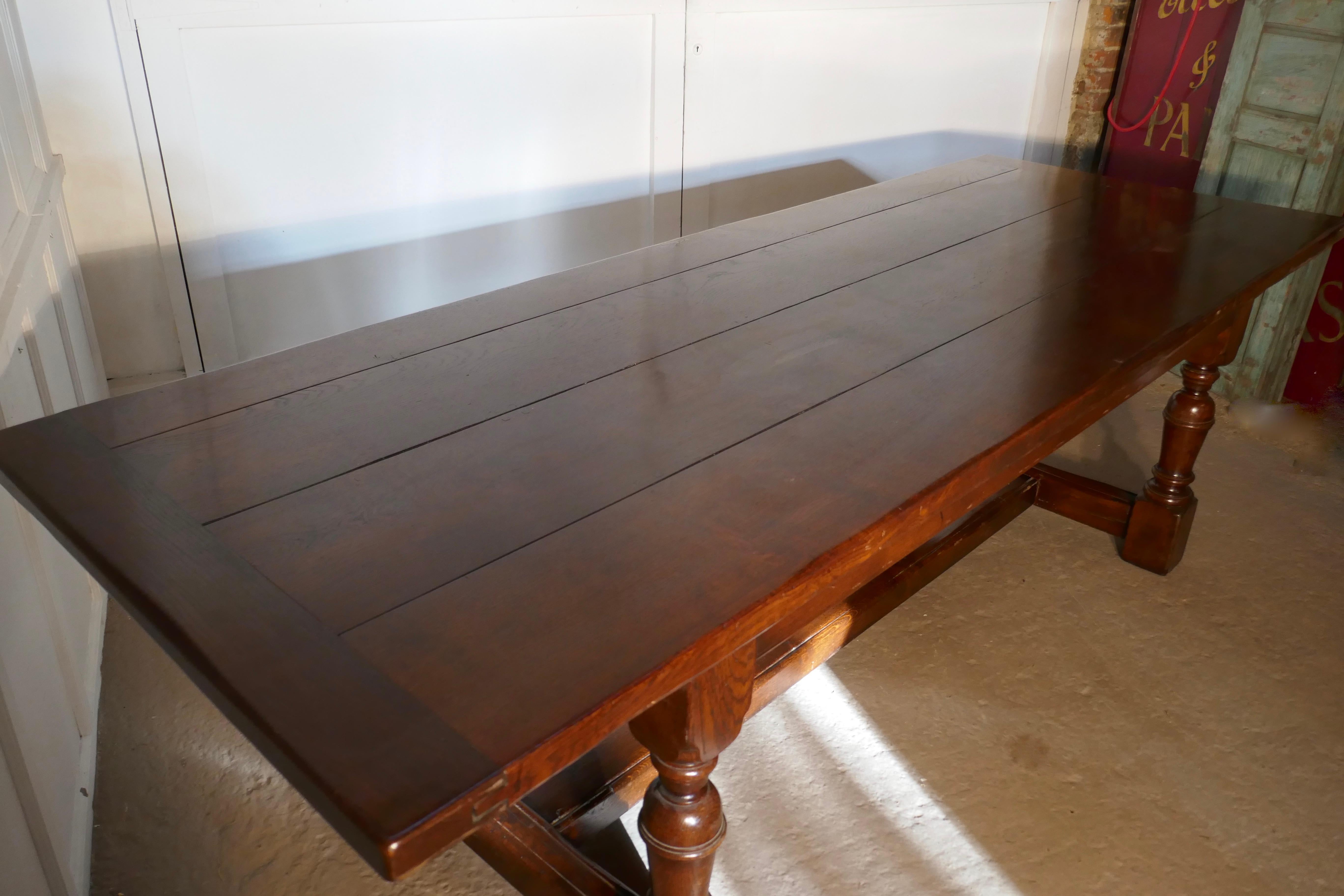 Superior quality oak refectory dining table

This is a very handsome table, it has a heavy solid 2” thick 4 plank top with cleated or breadboard ends it has very sturdy turned legs with a long wide H stretcher for even more added strength 

The