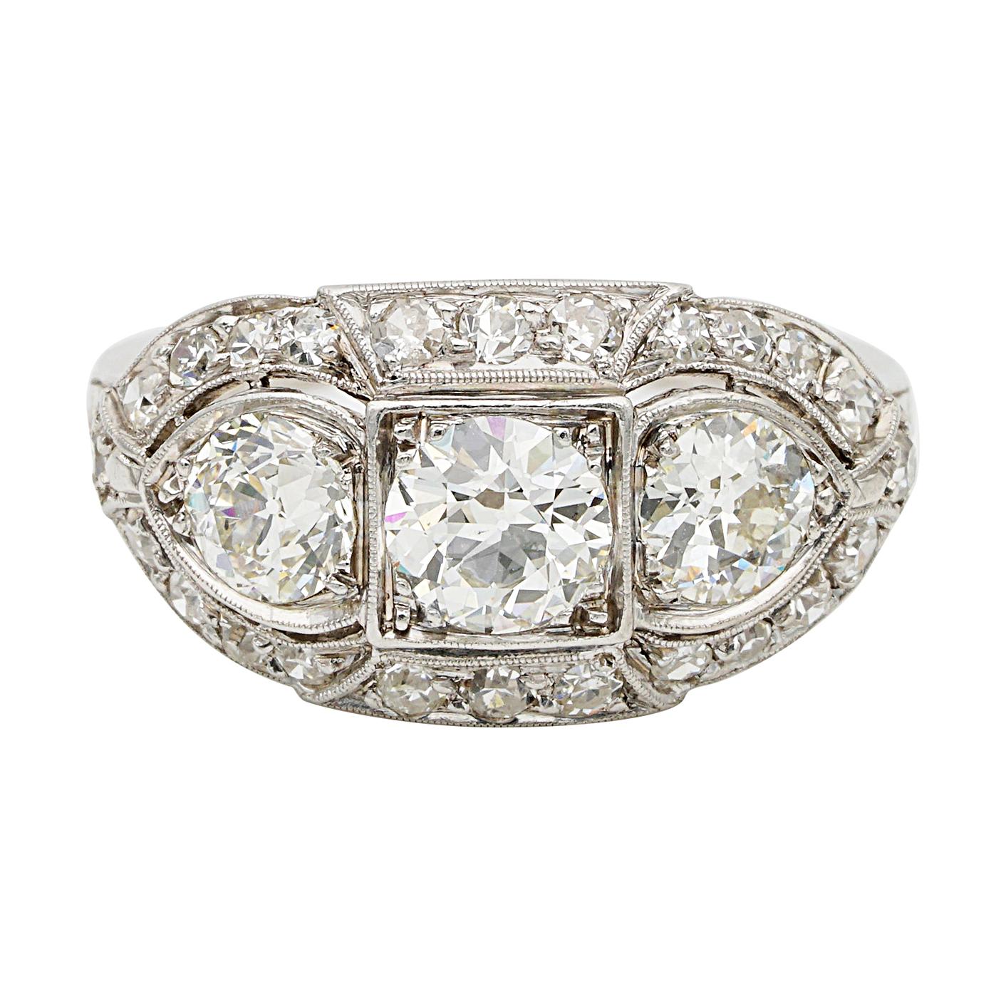 Superlative Art Deco 2.20 Carat Diamond Plus .70 Carat Platinum Three-Stone Ring For Sale