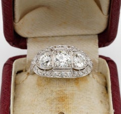 Superlative Art Deco 2.20 Carat Diamond Plus .70 Carat Platinum Three-Stone Ring